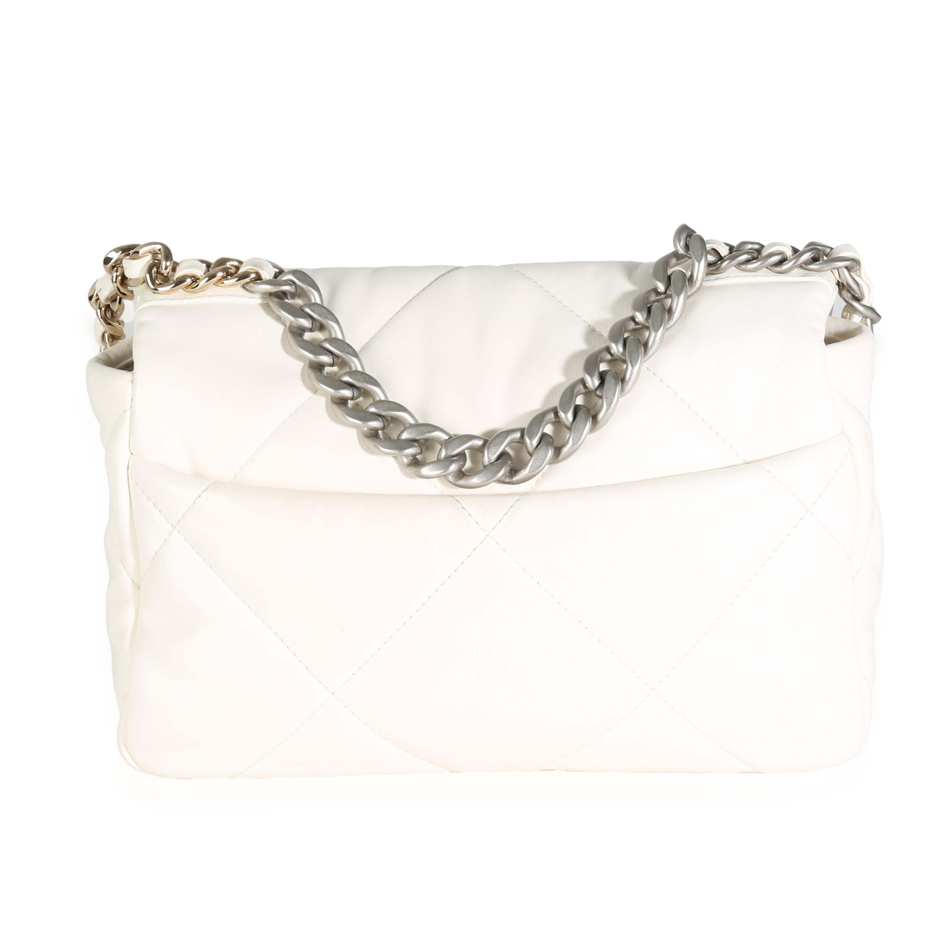 Listing Title: Chanel White Quilted Lambskin Small Chanel 19 Flap Bag
SKU: 141976
Condition: Pre-owned 
Condition Description: A timeless classic that never goes out of style, the flap bag from Chanel dates back to 1955 and has seen a number of