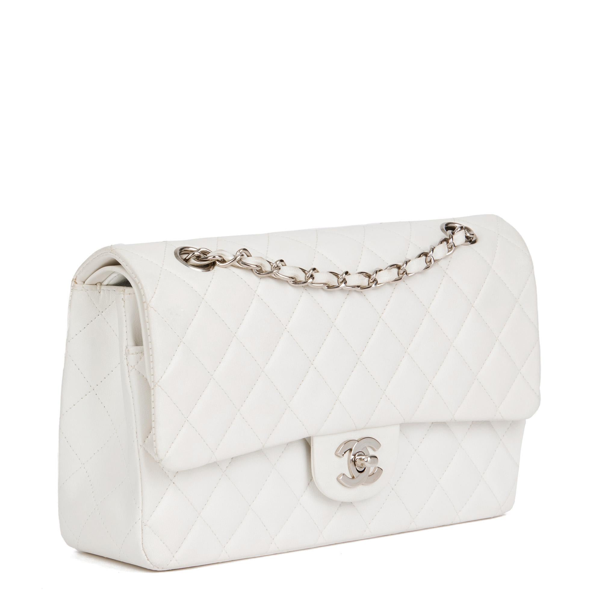 CHANEL
White Quilted Lambskin Vintage Medium Classic Double Flap Bag 

Serial Number: 5882551
Age (Circa): 1999
Accompanied By: Authenticity Card
Authenticity Details: Authenticity Card, Serial Sticker (Made in France)
Gender: Ladies
Type: