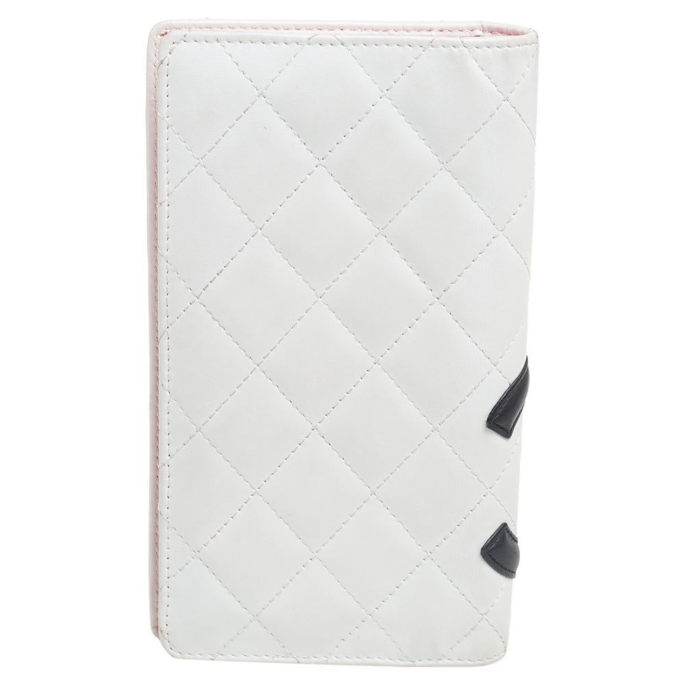 Chanel's unmatched aesthetics combined with unending glamour gives us this wonderful creation. This Cambon Ligne wallet from Chanel is made from white quilted leather with a contrast CC print adorning its structure. The bi-fold style of this wallet