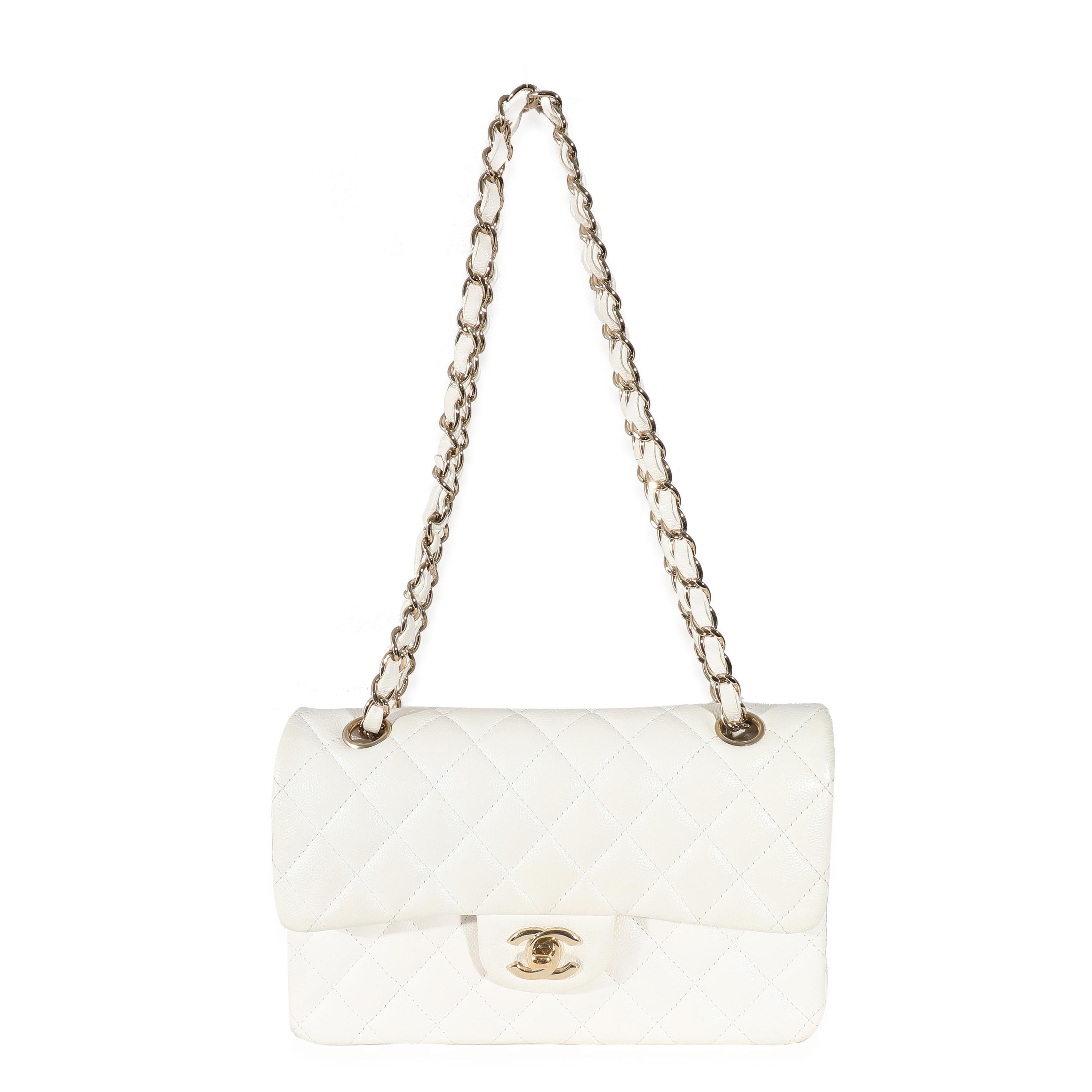Listing Title: Chanel White Quilted Caviar Small Classic Double Flap Bag
SKU: 133999
Condition: Pre-owned 
Condition Description: A timeless classic that never goes out of style, the flap bag from Chanel dates back to 1955 and has seen a number of