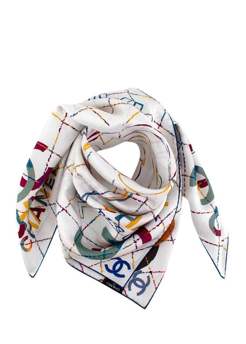 Chanel White Rose CC Logo Pattern Silk Twill Square Scarf 90

- White silk twill scarf with signature diamond quilt pattern in multicolour pastel hues
- Rose print to the center and logo's to the edges
- Peach orange rolled edges
- Reverse side in