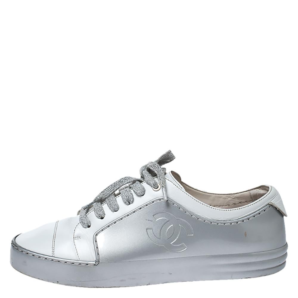 These sneakers from Chanel are perfect for a casual day out. They are crafted in Italy and are made from quality leather and rubber. They come in lovely hues of silver and white. They are styled with round toes, lace-ups on the vamps, iconic CC logo