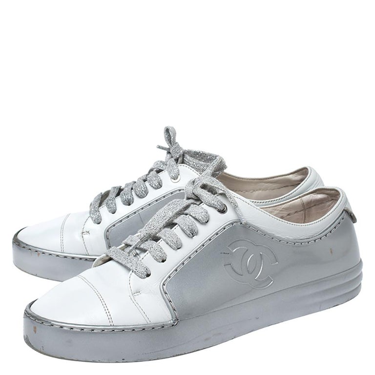Chanel White/Silver Leather And Rubber CC Cap Toe Lace Up Sneaker Size 38  at 1stDibs  chanel silver and white sneakers, silver and white chanel  sneakers, white and silver chanel sneakers
