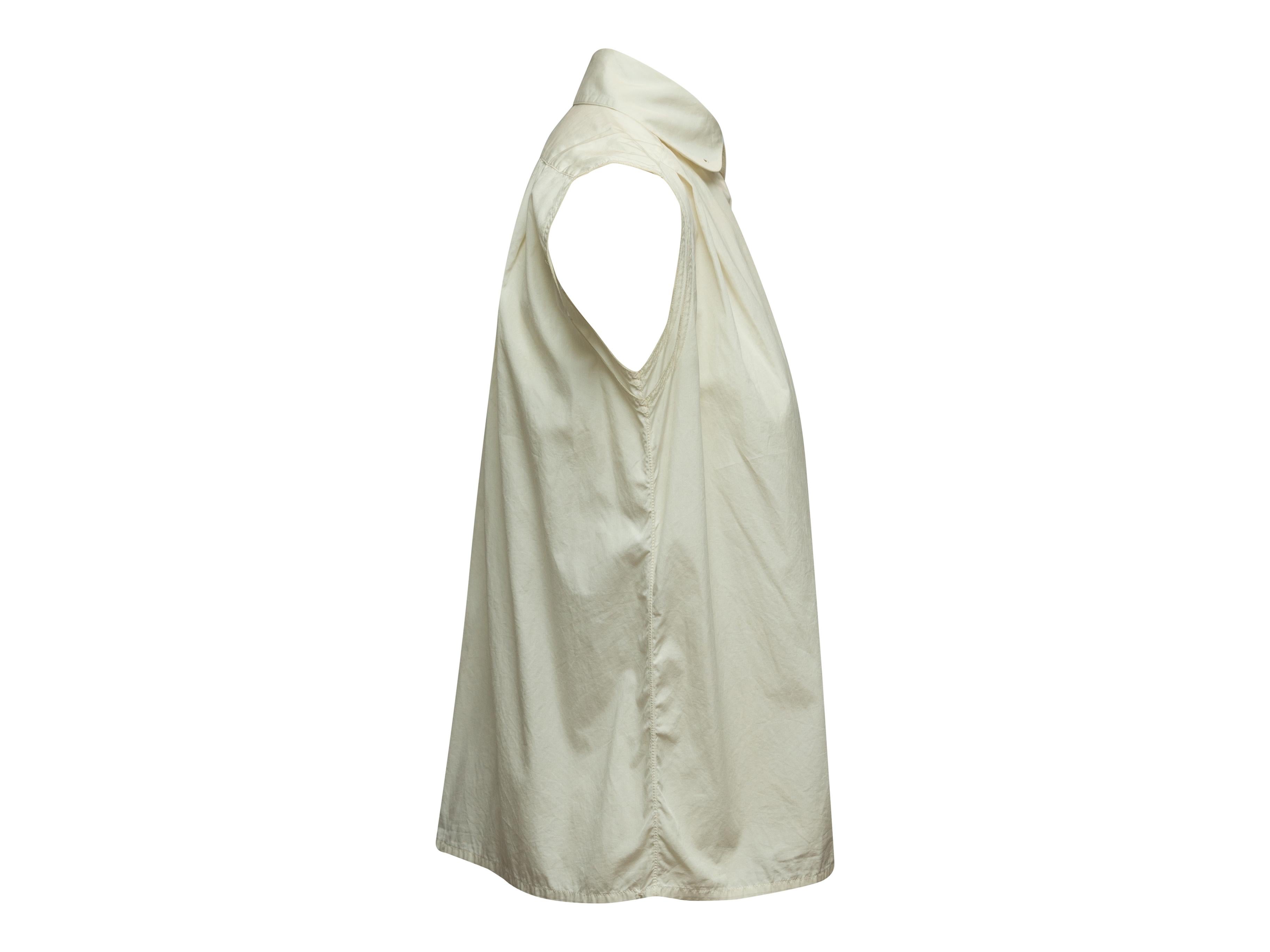 Product details: Vintage white sleeveless top by Chanel. Peter Pan collar. Concealed closures at front. 41