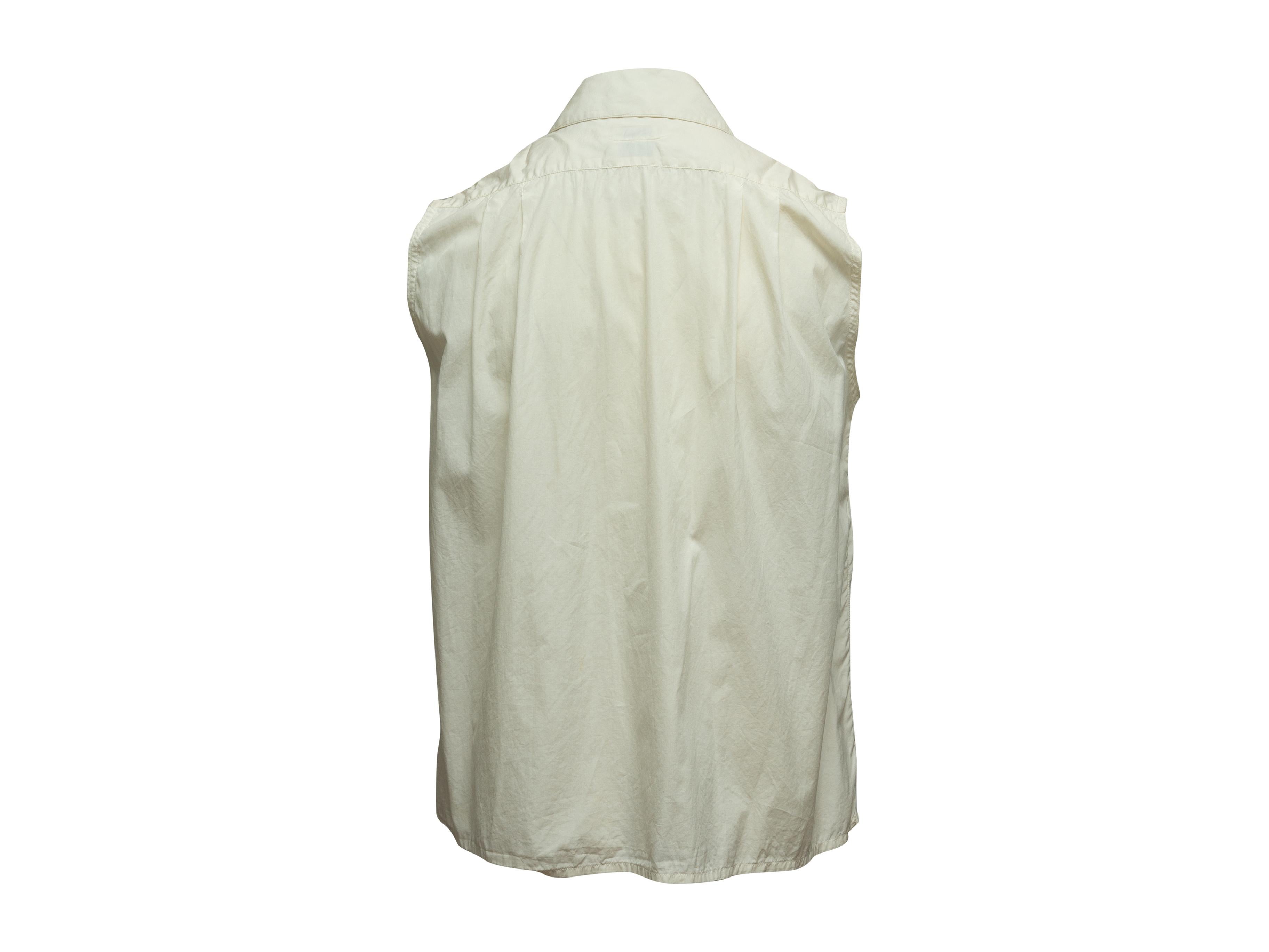 white sleeveless collared blouse