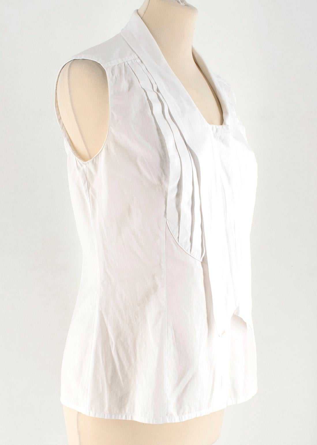 Chanel White Sleeveless Shirt Top

- white cotton shirt 
- round neckline 
- sleeveless 
- button fastening to the front

All measurements are taken seam to seam:
This item has no sizing labels, however, it is estimated to be a size S. Please refer