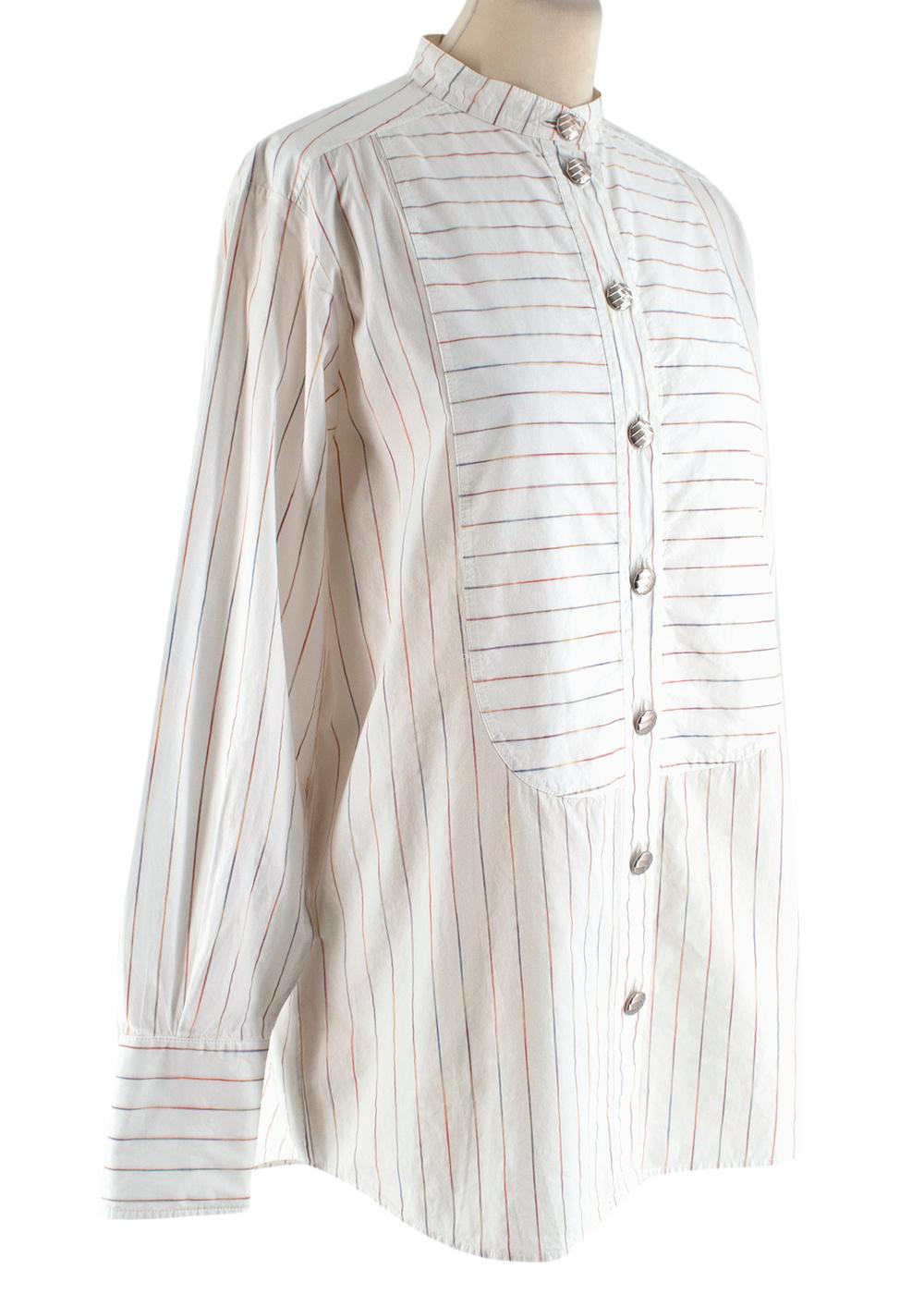 Chanel White Pinstripe Shirt
Collarless Shirt
Rainbow stripes
Silver buttons with detail and Chanel logo
100% cotton
Made in Italy

43cm shoulder
53cm shoulder
59cm sleeve with 11cm cuff
68cm length
