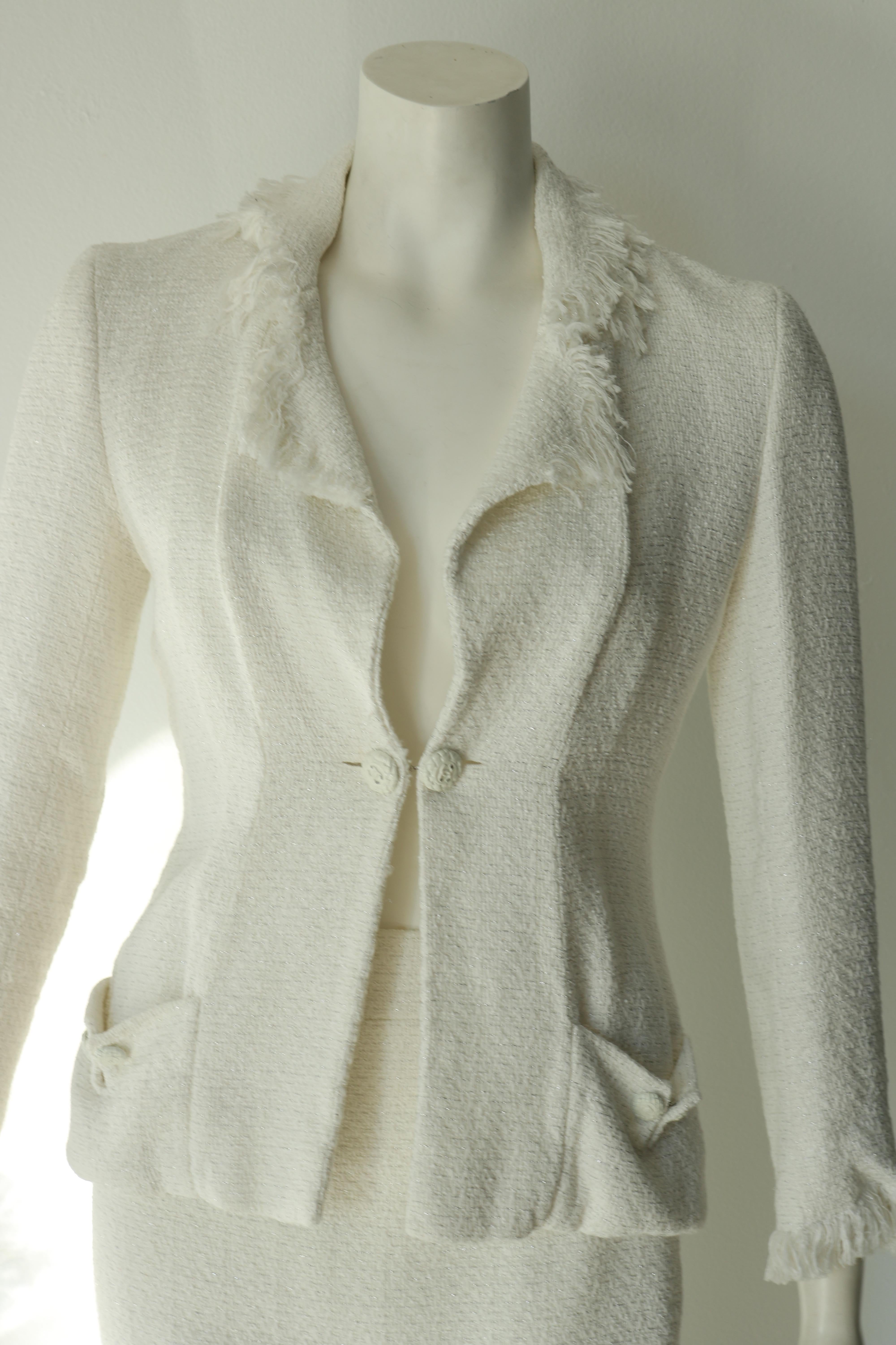 Stunning and classy Chanel skirt suit. 
The tweed is white with silver detail.
Size 40
Made in France 