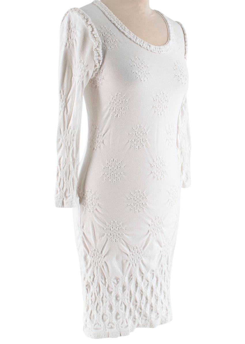 Chanel White Textured Long Sleeve Mini Dress 

- Perforated detailing
- Crinkle fabric design
- Stretch fabric
- Boat neckline

Shoulders: 36cm
Waist: 32cm
Length:79cm
Sleeve length: 45cm
75% Viscose, 25% Nylon

Made in France

Dry clean