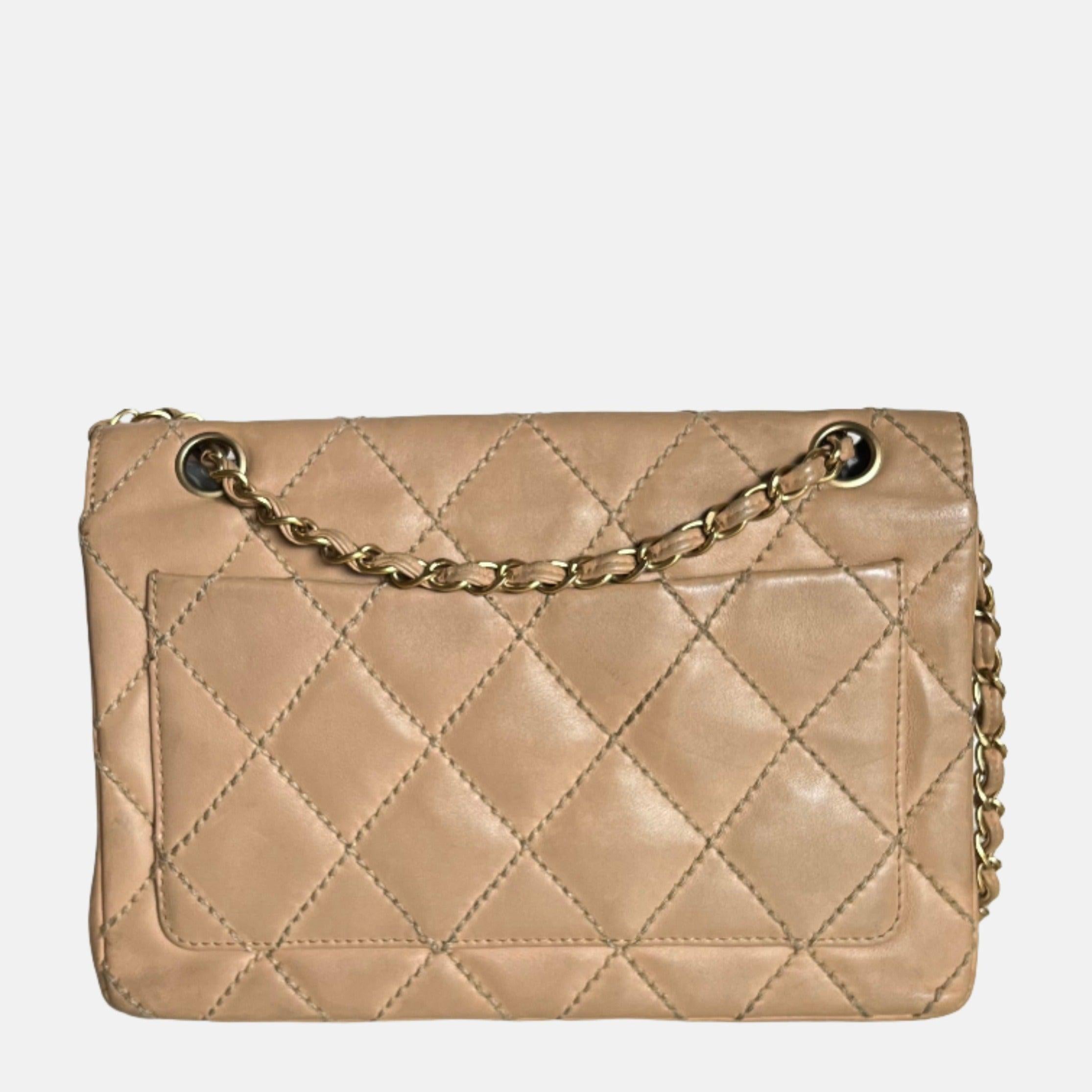 Chanel Wild Stitch Flap Beige Leather with Stitching Detail


Accent your wardrobe with this timeless vintage Chanel Classic Flap handbag, crafted from a durable beige leather and modernized with a beige stitching detail. The antiqued gold hardware
