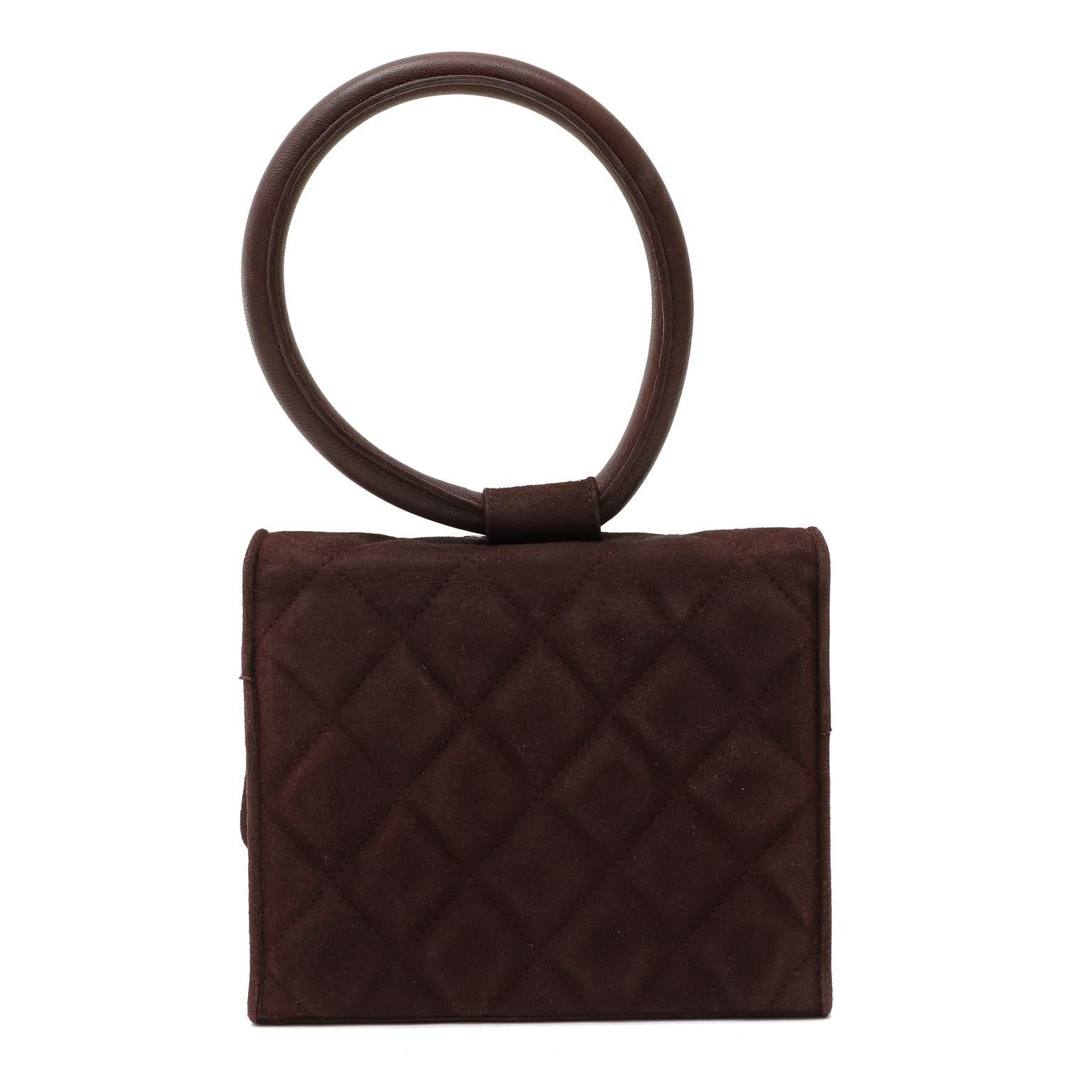 This authentic Chanel Dark Brown Suede Gripoix Jewels Evening Bag is in mint condition. A very rare piece featuring an iconic Chanel Gripoix flower design that is a must have for any collector.
Deep wine suede is quilted in signature Chanel diamond