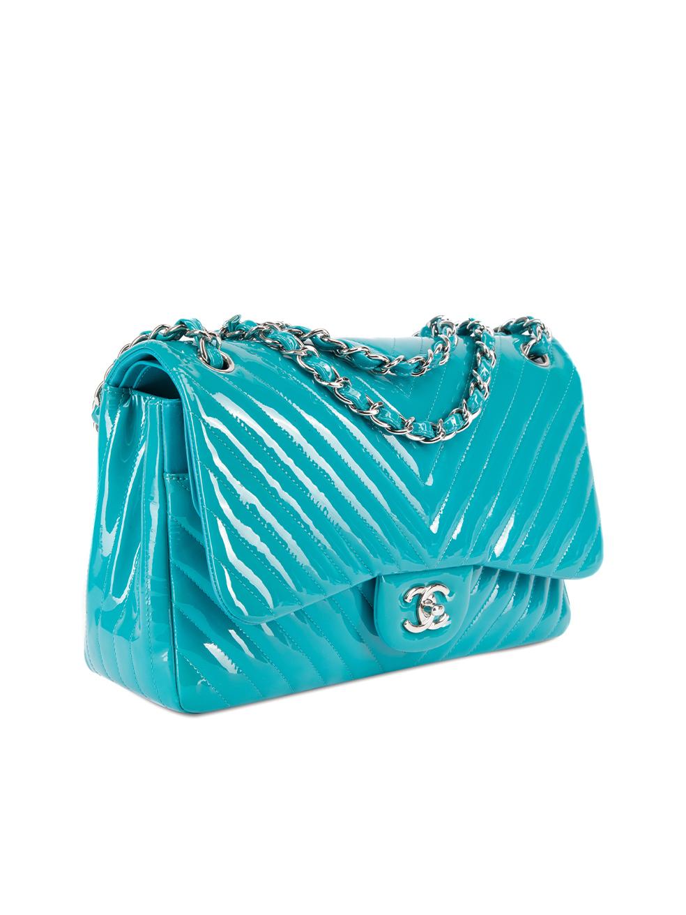 CONDITION is Very good. Minimal wear to bag is evident. Minimal wear to the leather under the inner bag flap which has maekeup stains on this used Chanel designer resale item.   Details  2014-2015 Turquoise Patent leather Large shoulder bag Chevron