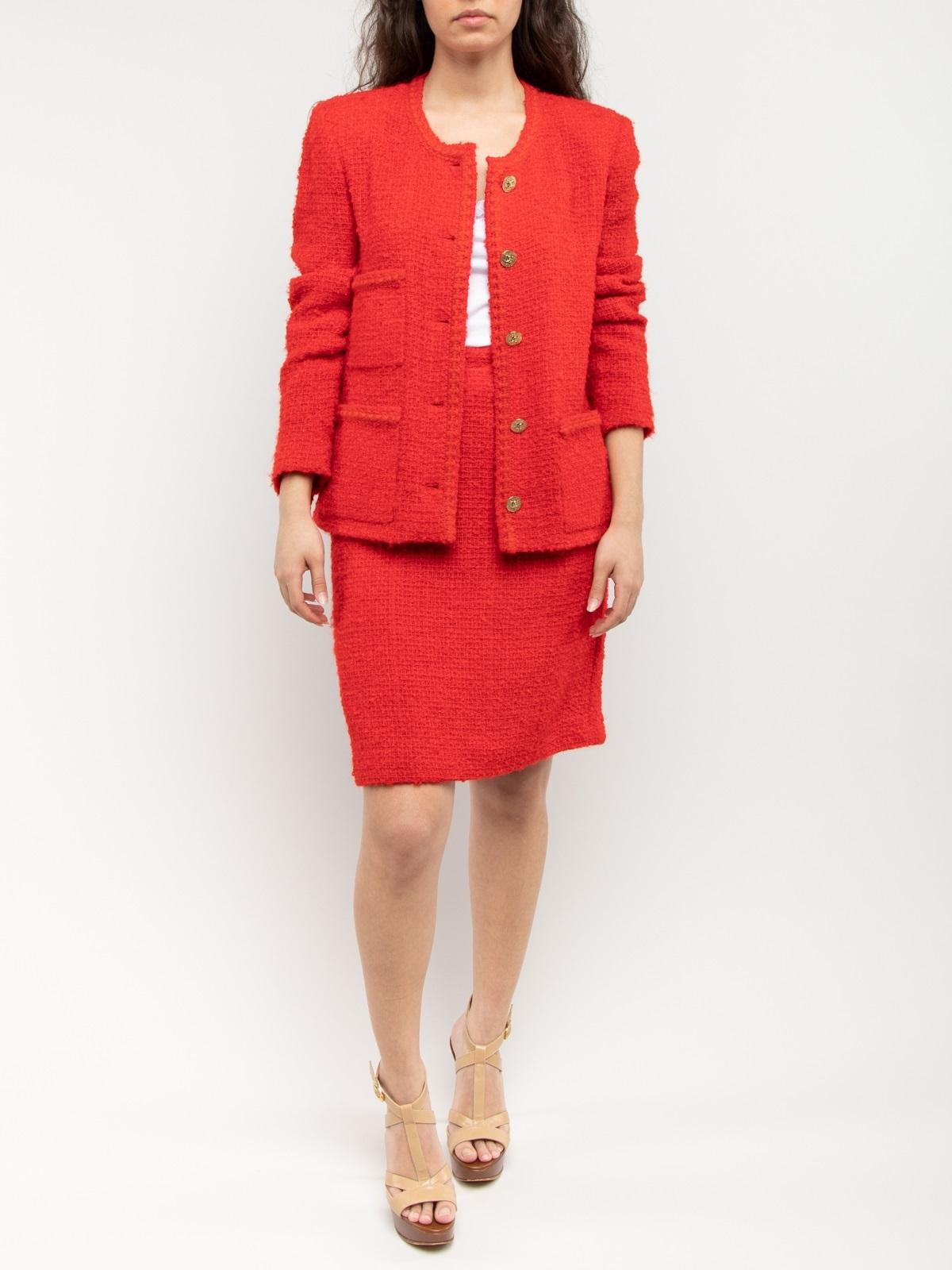 Editor\'s Note The used Chanel tweed suit is one of the most iconic designs in fashion history and this red vintage couture suit jacket and skirt set is a truly unique interpretation on the brand's timeless classic. Pair with one of CSD's pre-loved
