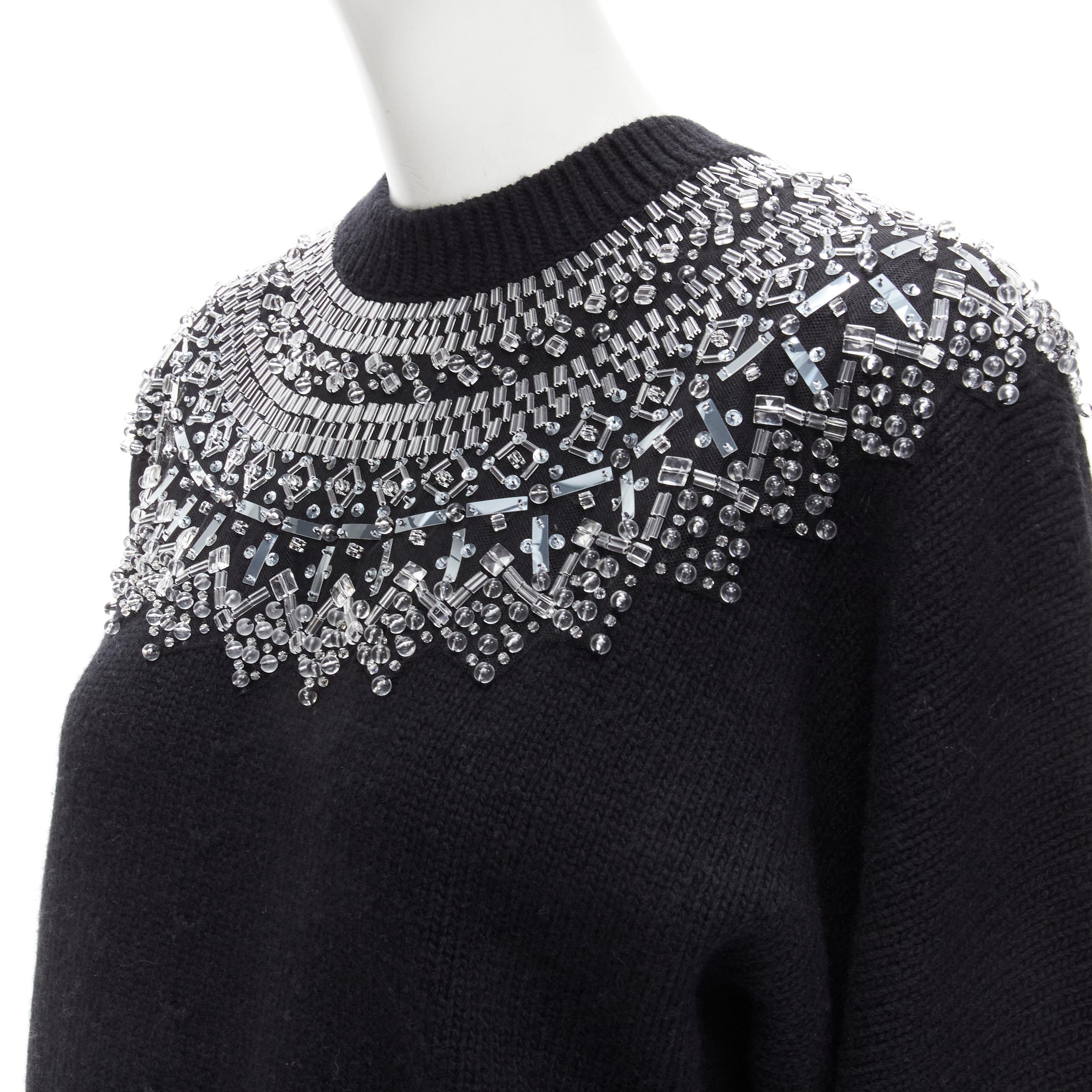 CHANEL wool cashmere black crystal bead embellished fairisle sweater FR34 XS
Brand: Chanel
Material: Wool
Color: Black
Pattern: Solid
Extra Detail: Black crew neck wool-cashmere blend sweater. Clear bead, sequins and crystal embellishment at collar.