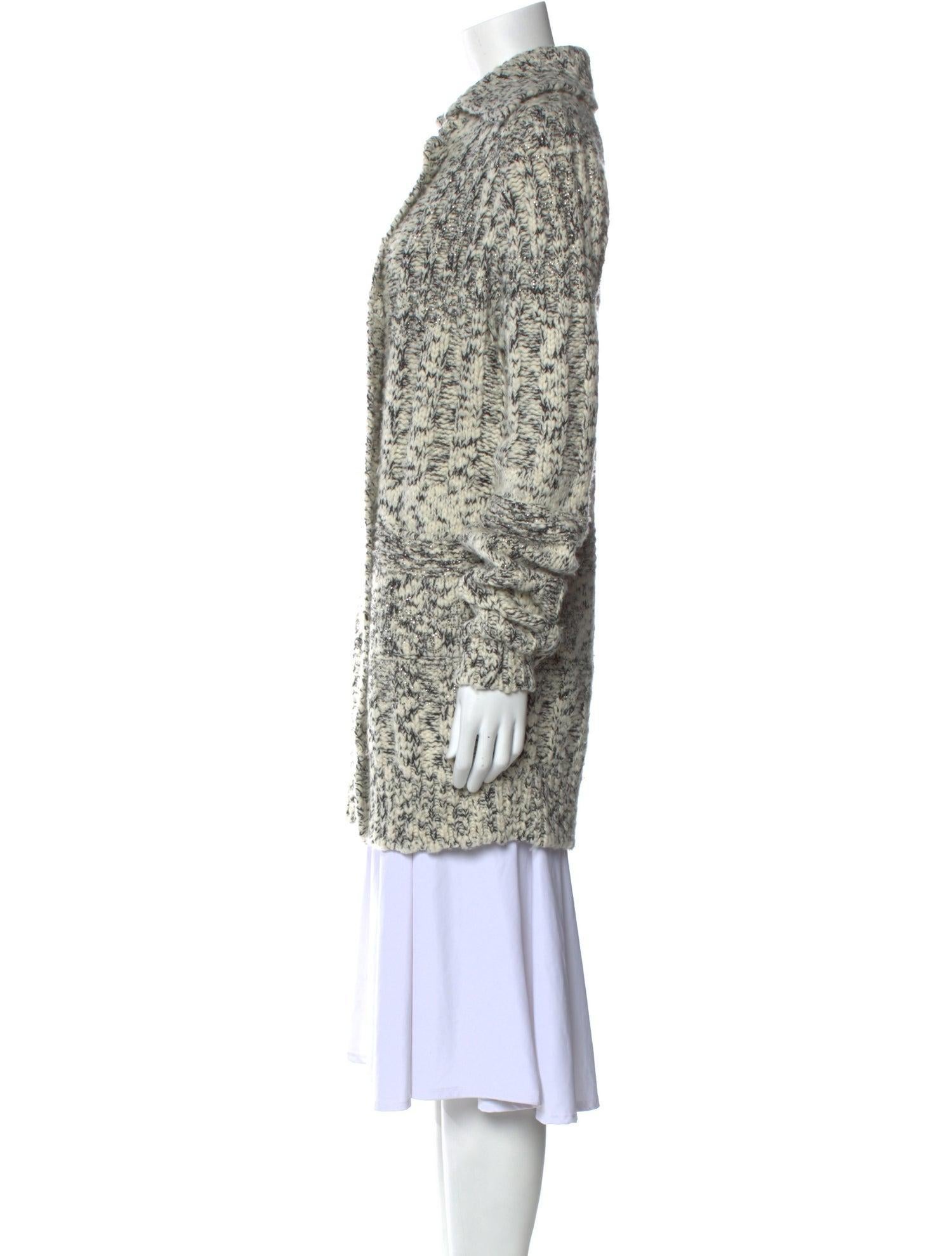 CHANEL WOOL CASHMERE BLEND LONG KNIT JACKET (SMALL)

This Chanel long knit jacket from the Fall 2010 collection by Karl Lagerfeld is a sophisticated wardrobe essential. Designed with a crew neckline and long sleeves, this tunic-style sweater jacket