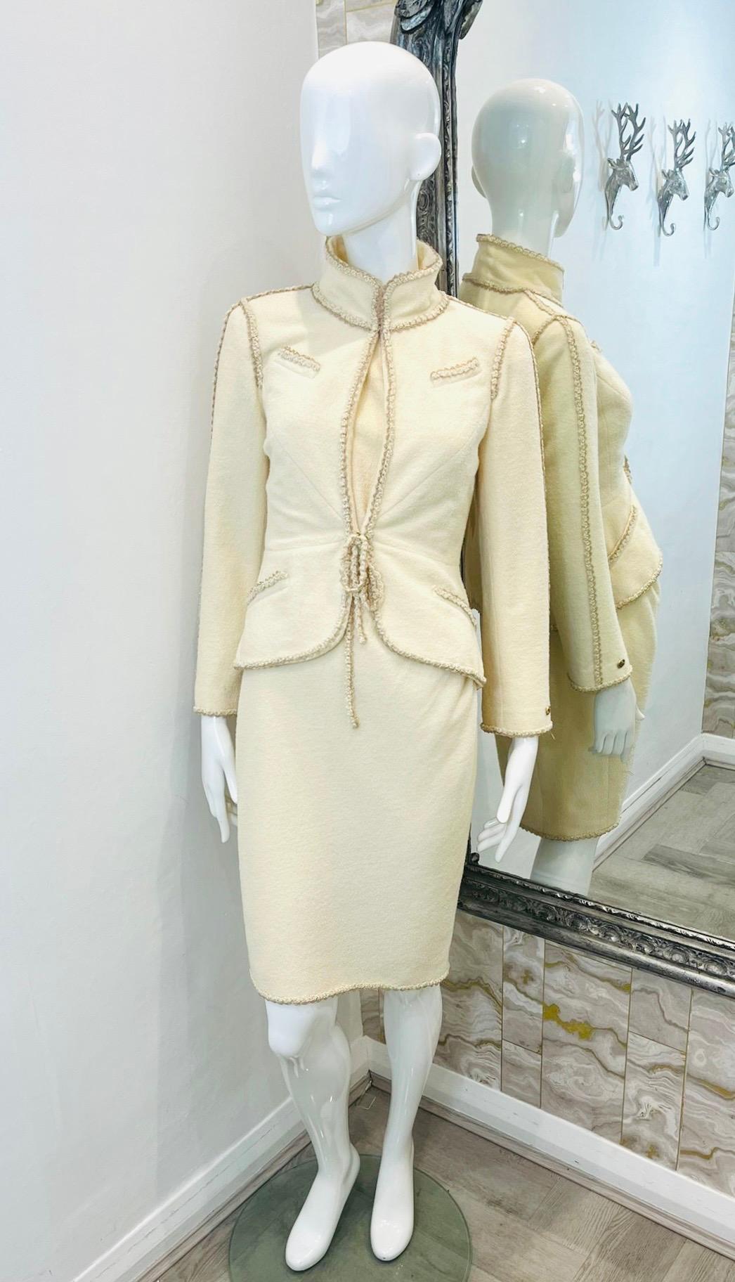 Chanel Wool & Silk Blend Tweed Dress & Jacket Set

Ivory set consisting of a sheath dress and fitted jacket.

Sleeveless, above-the-knee dress designed with round neckline and zip fastening to rear detailed with gold 'CC' logo.

Collared jacket