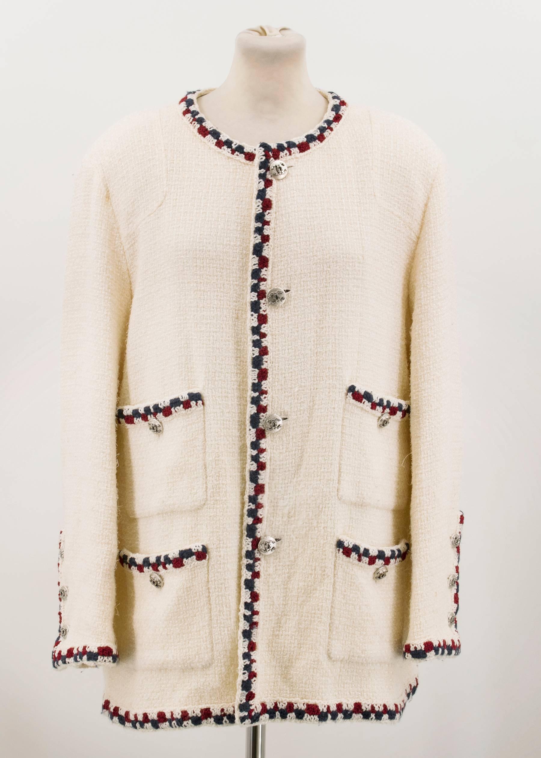 Chanel wool blend cream tweed jacket with blue, cream and wine details on collar, bust, pockets and cuffs. Silver metal 'CC' buttons. 4 front pockets. Fully lined in silk. Padded shoulders. 

Measurements	
Approx: Length - 78cm Sleeve - 44cm Bust -
