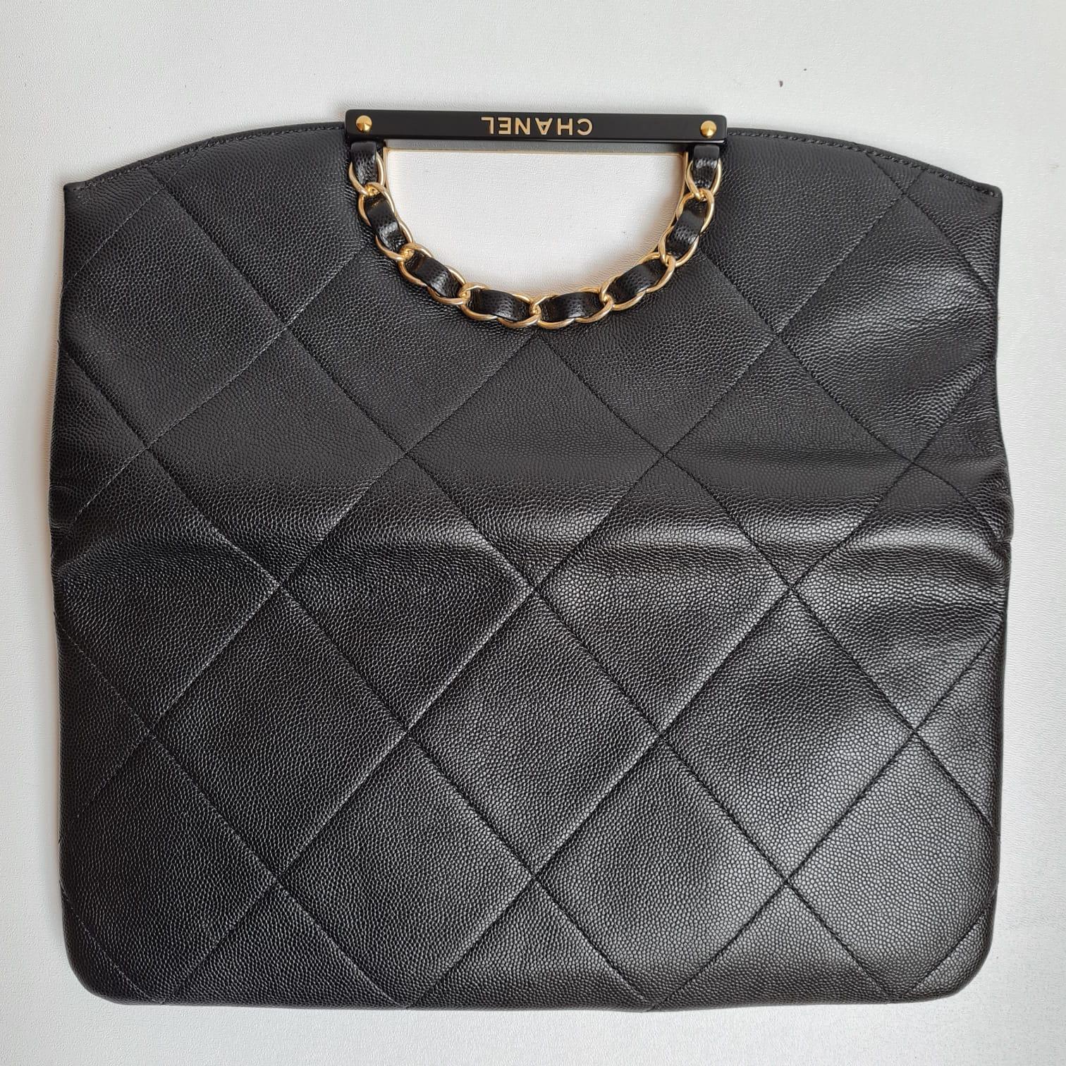 Excellent condition Chanel chain handle flap clutch. Overall still in excellent condition with light wear marks. Serial number #29. Comes with dust bag.