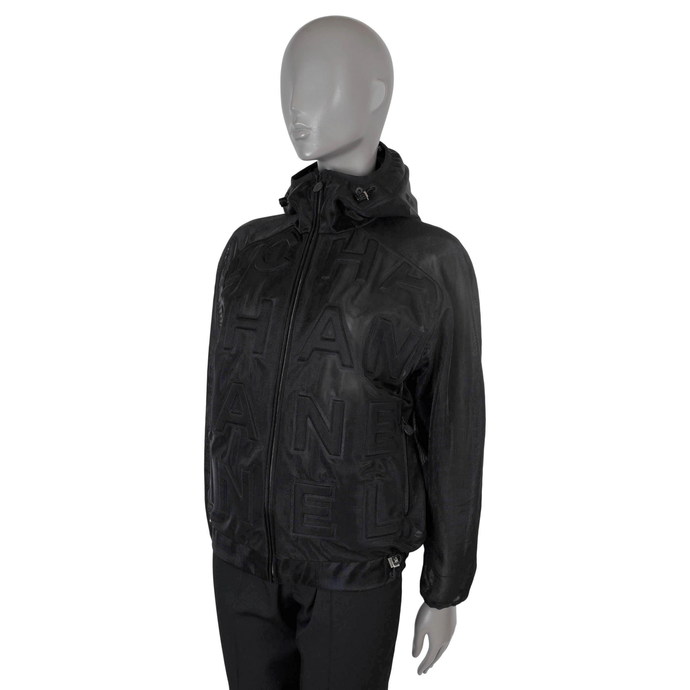 100% authentic Chanel x Pharell Williams bomber in black mesh polyamide (100%). Features thick all-over logo debossing, two zip pockets at the waist, a drawstring hood and bottom hem. Closes with a zipper on the front and is unlined. Has been worn