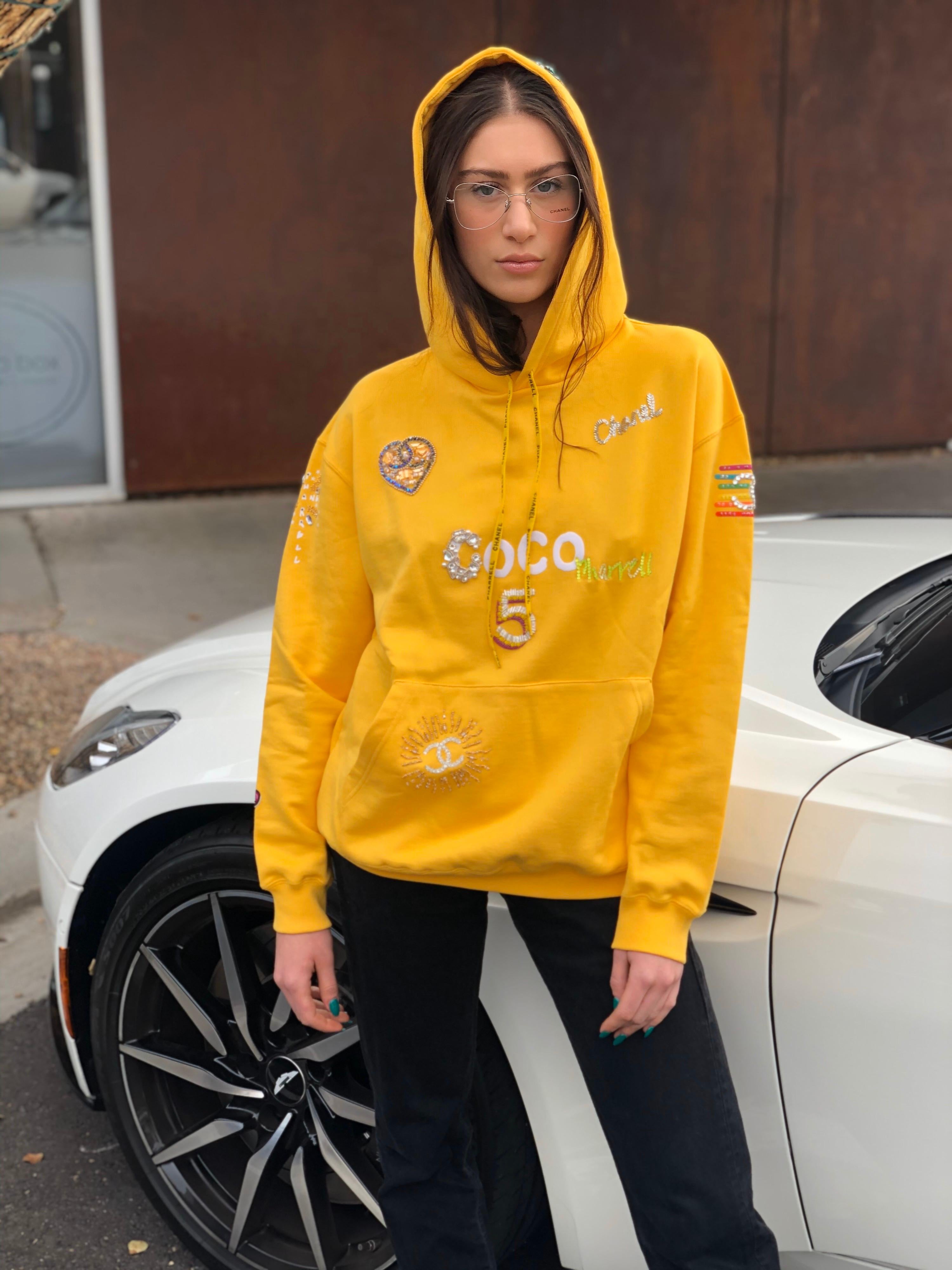 Chanel x Pharrell 2019 Appliqué Sunflower Yellow Hoodie For Sale at 1stDibs chanel hoodie, chanel x pharrell hoodie, yellow black chanel hoodie