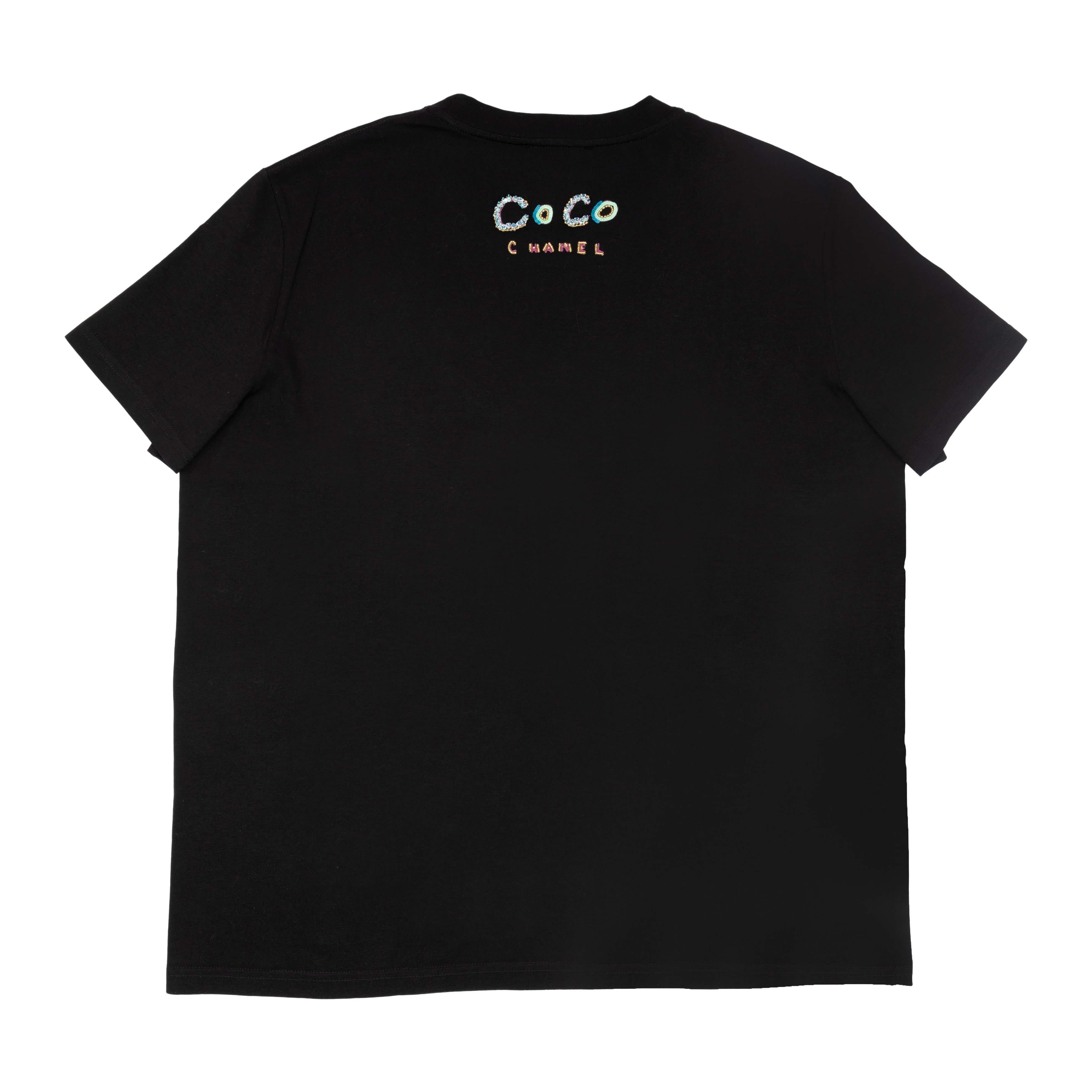 Imbue the playful spirit to your timeless closet with this Chanel x Pharrell Capsule Collection Black Embellished Cotton Short Sleeve T-Shirt. This 2019 limited edition piece is embellished with beads and sequins for a bold touch.

NFT option