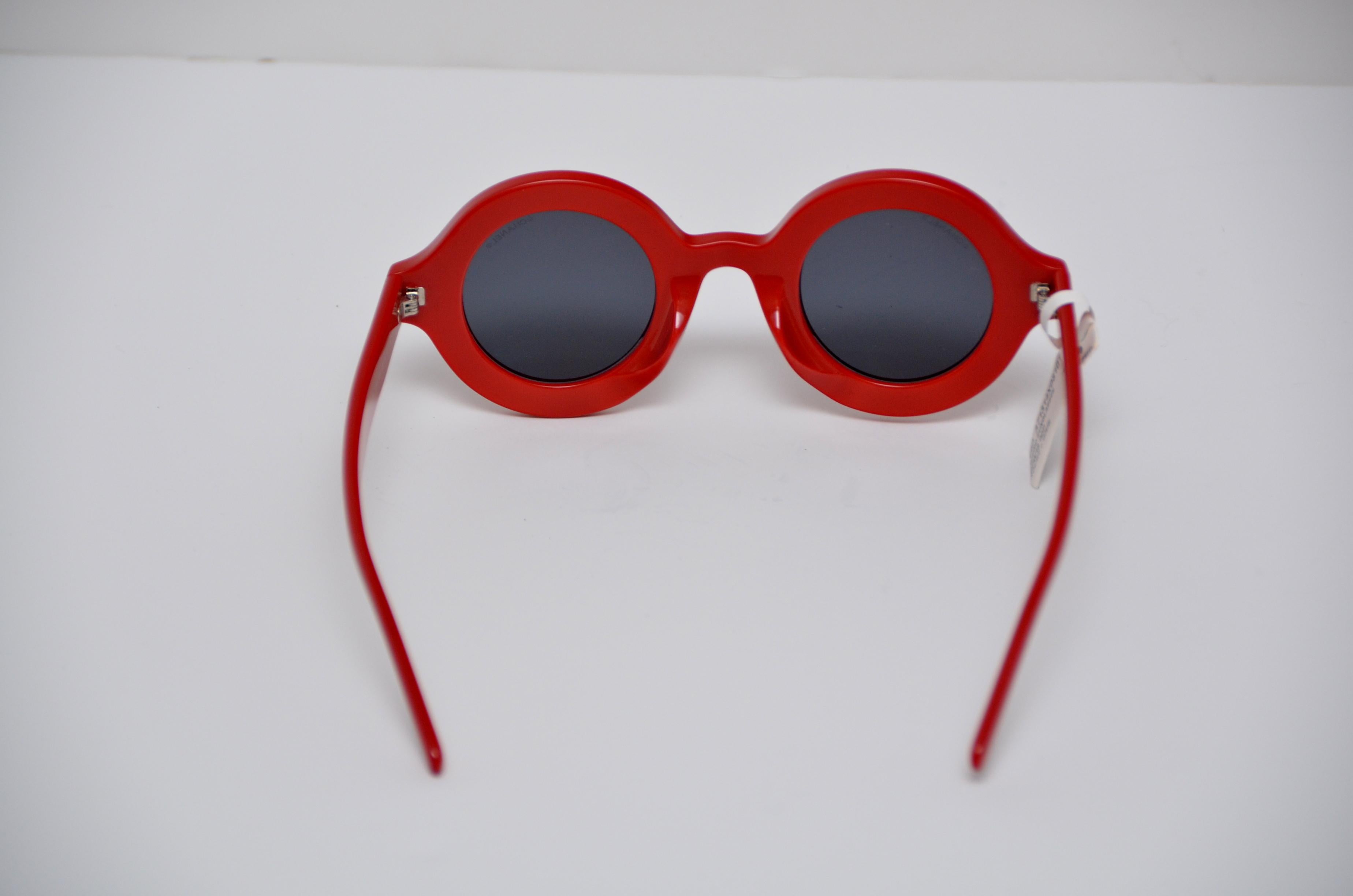 100% guaranteed authentic Chanel x Pharrell Capsule Collection Sunglasses .  
An urban capsule collection highlighting Pharrell Williams’ longterm relationship with the House of Chanel and initiated by Karl Lagerfeld .  
Color:  Red Rouge +Gris 