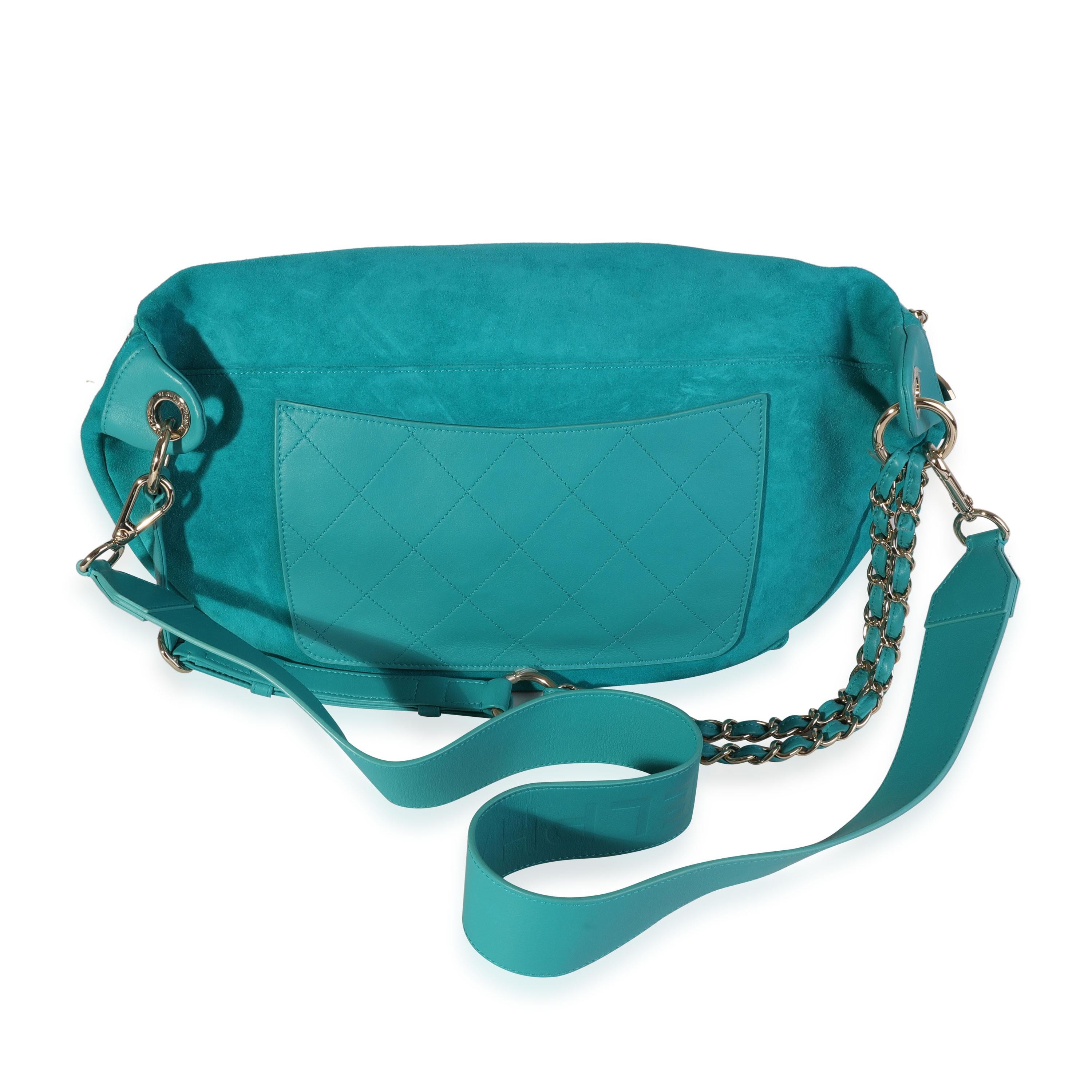Listing Title: Chanel x Pharrell Williams Teal Suede & Quilted Calfskin Oversize Waist Bag
SKU: 119972
MSRP: 6900.00
Condition: Pre-owned (3000)
Handbag Condition: Excellent
Condition Comments: Excellent Condition. Plastic on some hardware. Light