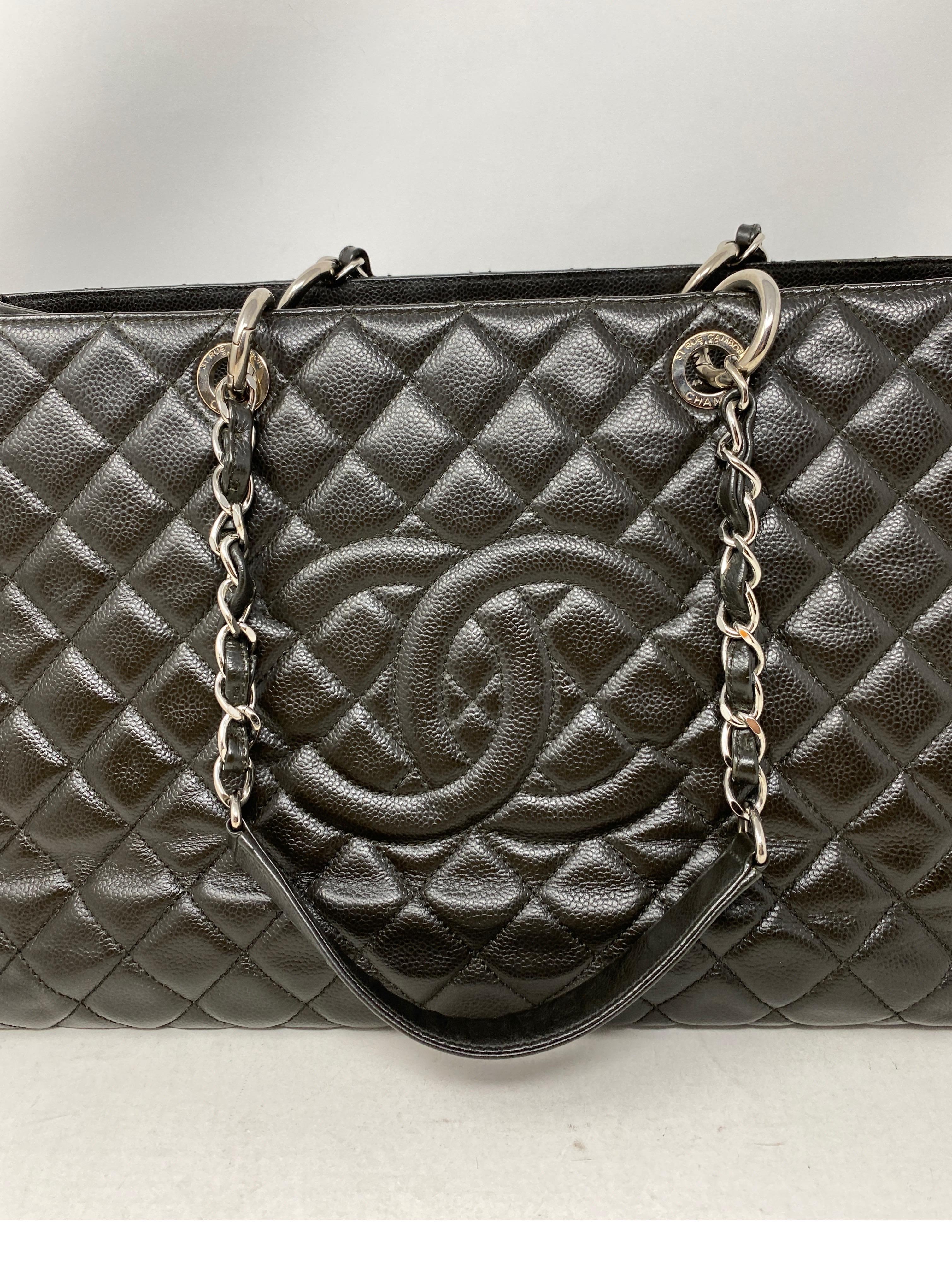 Chanel XL Black Grand Shopper Tote Bag. Silver hardware. Almost dark brown/ black color. Great neutral bag. Oversized XL tote to fit laptop or more. Caviar leather. Hard to find size. Retired style from Chanel. Has light wear on the inside. A few