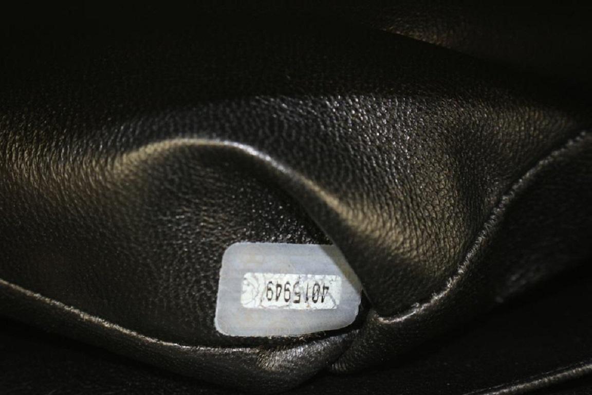 Noir Chanel XL Maxi - Sac à rabat unique en cuir verni matelassé noir 92ca66 en vente