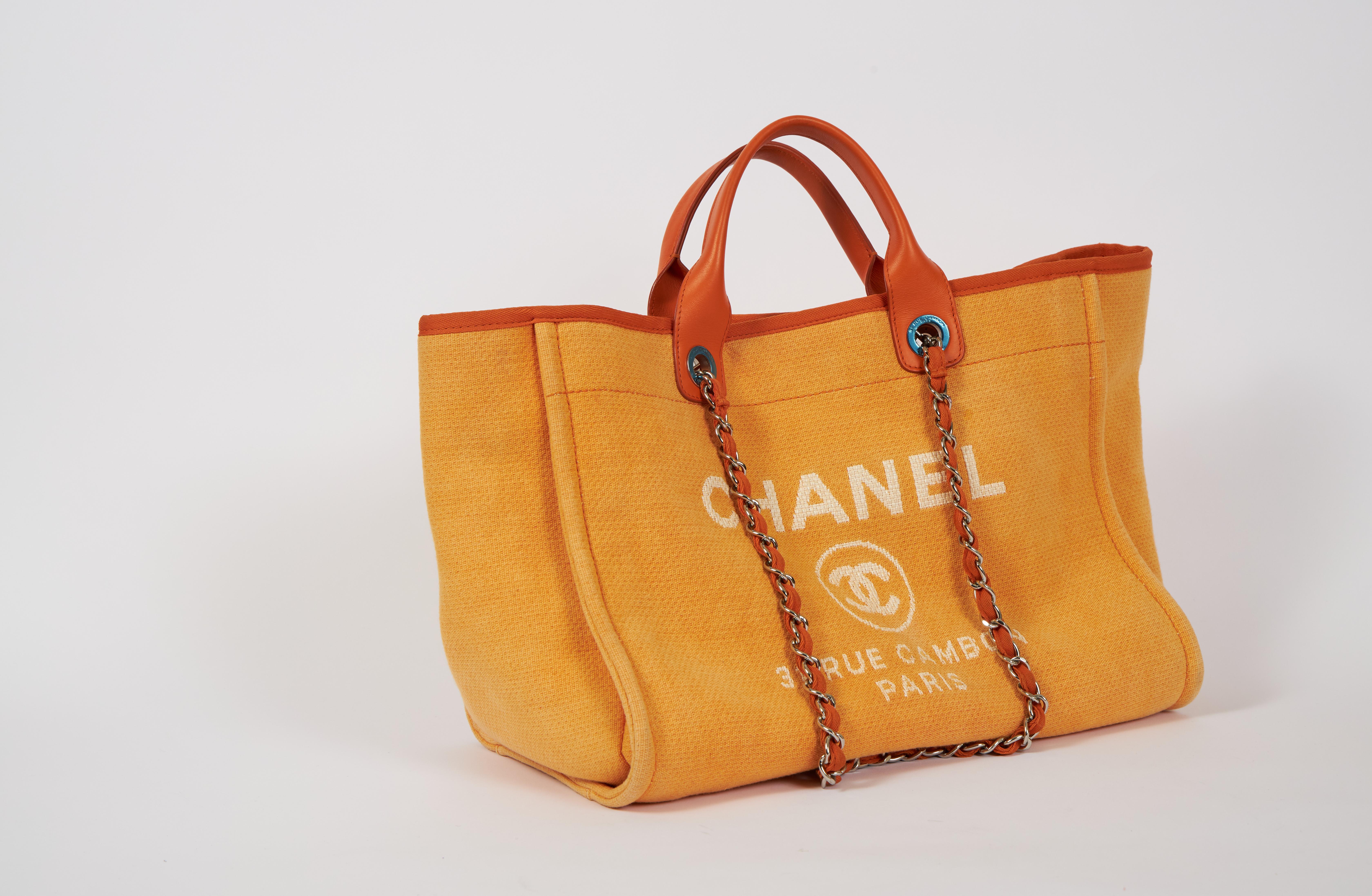 Chanel extra-large Deauville orange tote. Retains plastic on hardware. Handle drop, 4.5