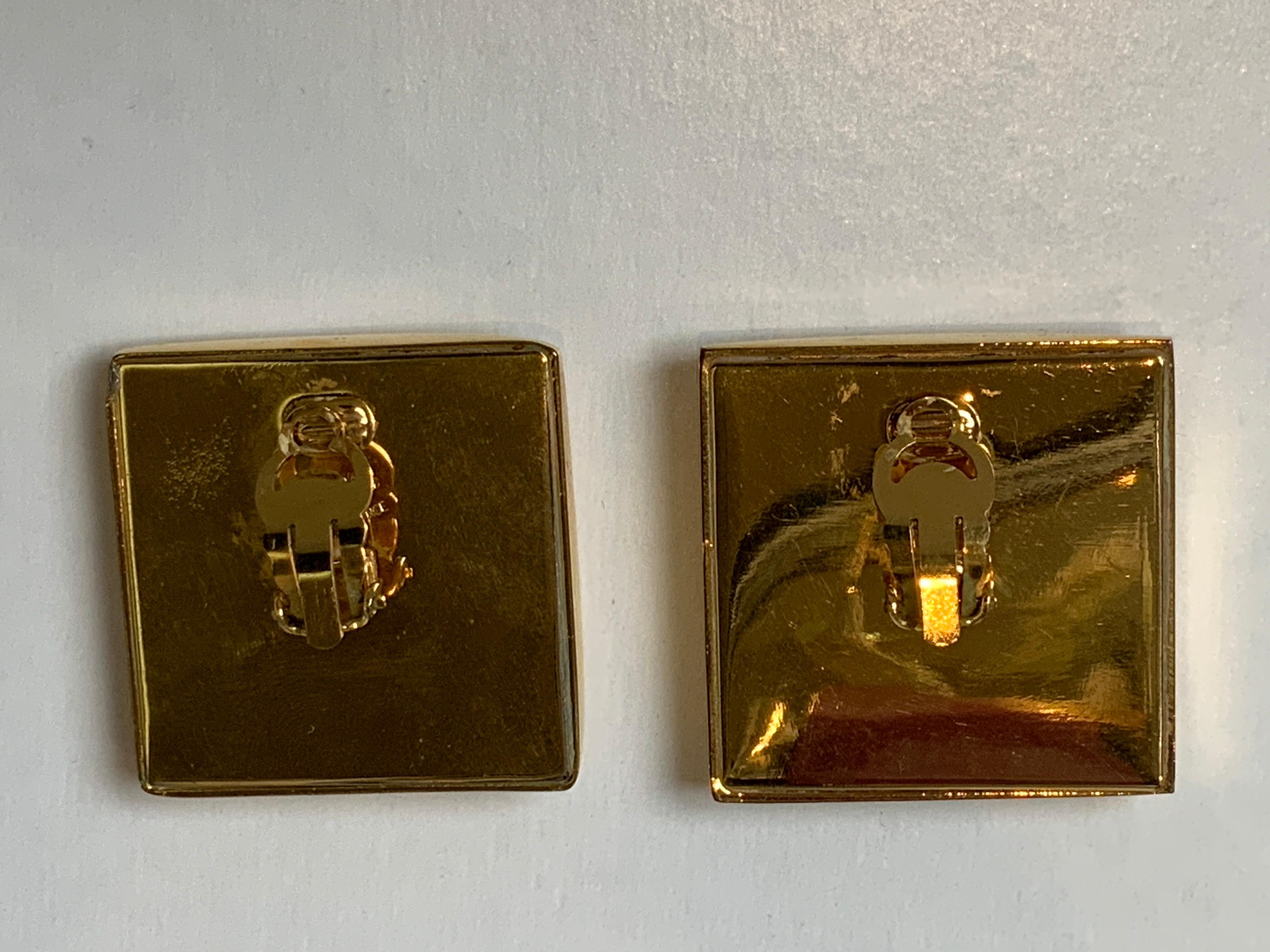 Chanel XXL 24k gold plated square CC statement earrings with decorative screws at the corners and blackened CC’s. Earrings are clip ons. Construction is hollow and they are lighter than they look. Made in France. Excellent condition. They measure