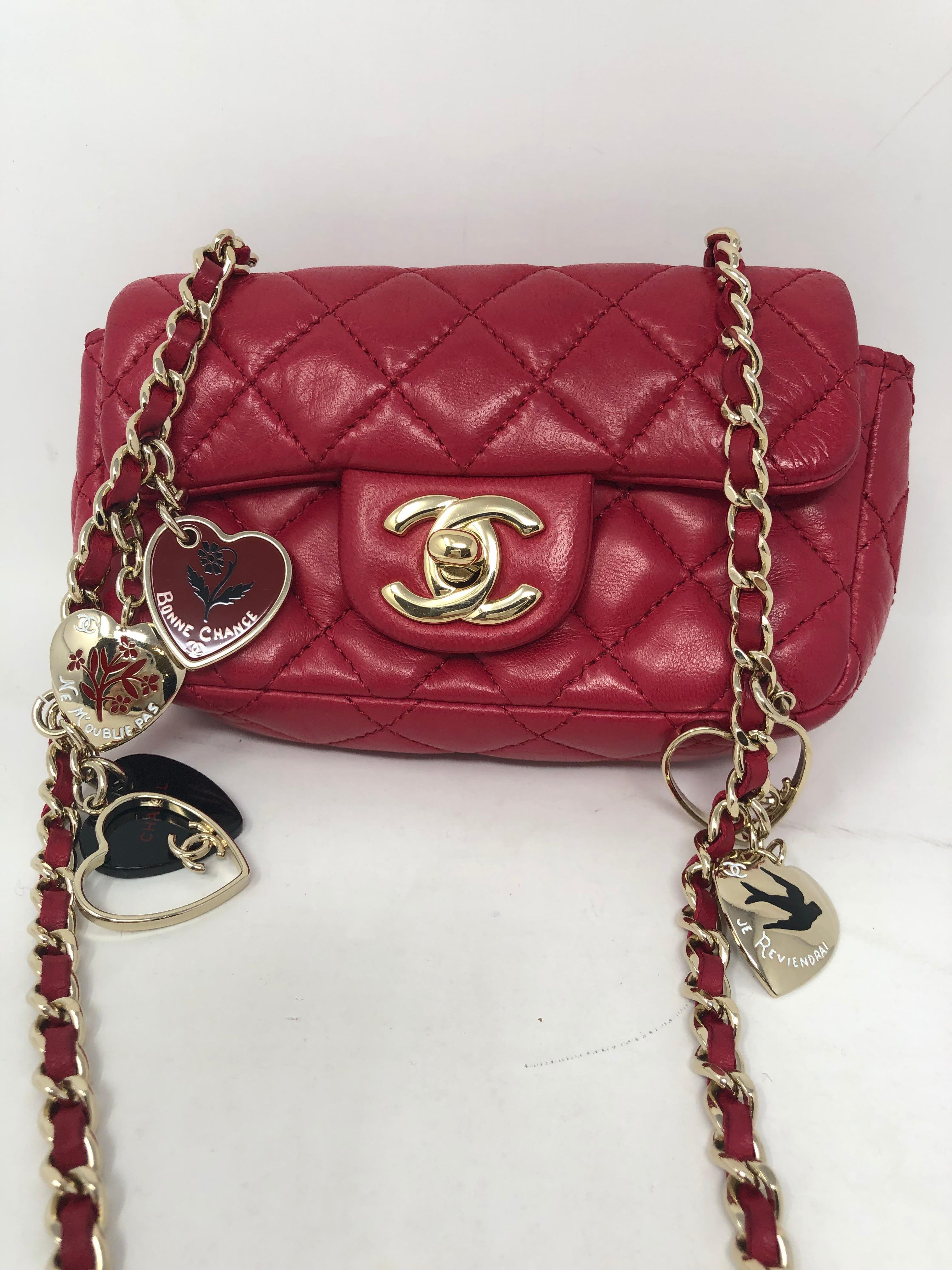 Chanel XS Mini Hot Pink Valentine's Bag. Crossbody Mini with heart charms in gold hardware. Mint condition. Cute Collector's Chanel piece. Guaranteed authentic. 