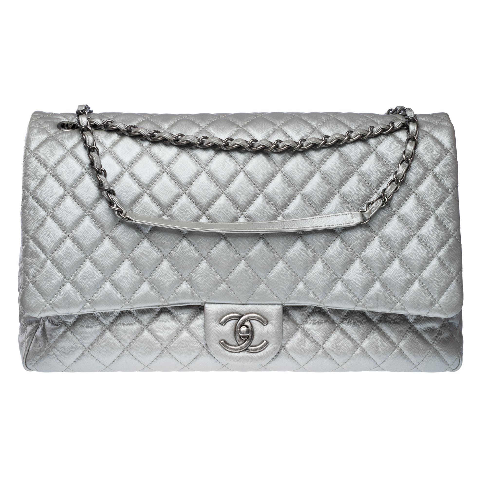 Majestic​ ​and​ ​Rare​ ​Chanel​ ​Classic​ ​XXL​ ​Airlines​ ​flap​ ​shoulder​ ​bag​ ​in​ ​quilted​ ​metallic​ ​silver​ ​caviar​ ​leather,​ ​ruthenium​ ​metal​ ​trim,​ ​intertwined​ ​ruthenium​ ​metal​ ​chain​ ​handle​ ​with​ ​silver​ ​leather​ ​for​