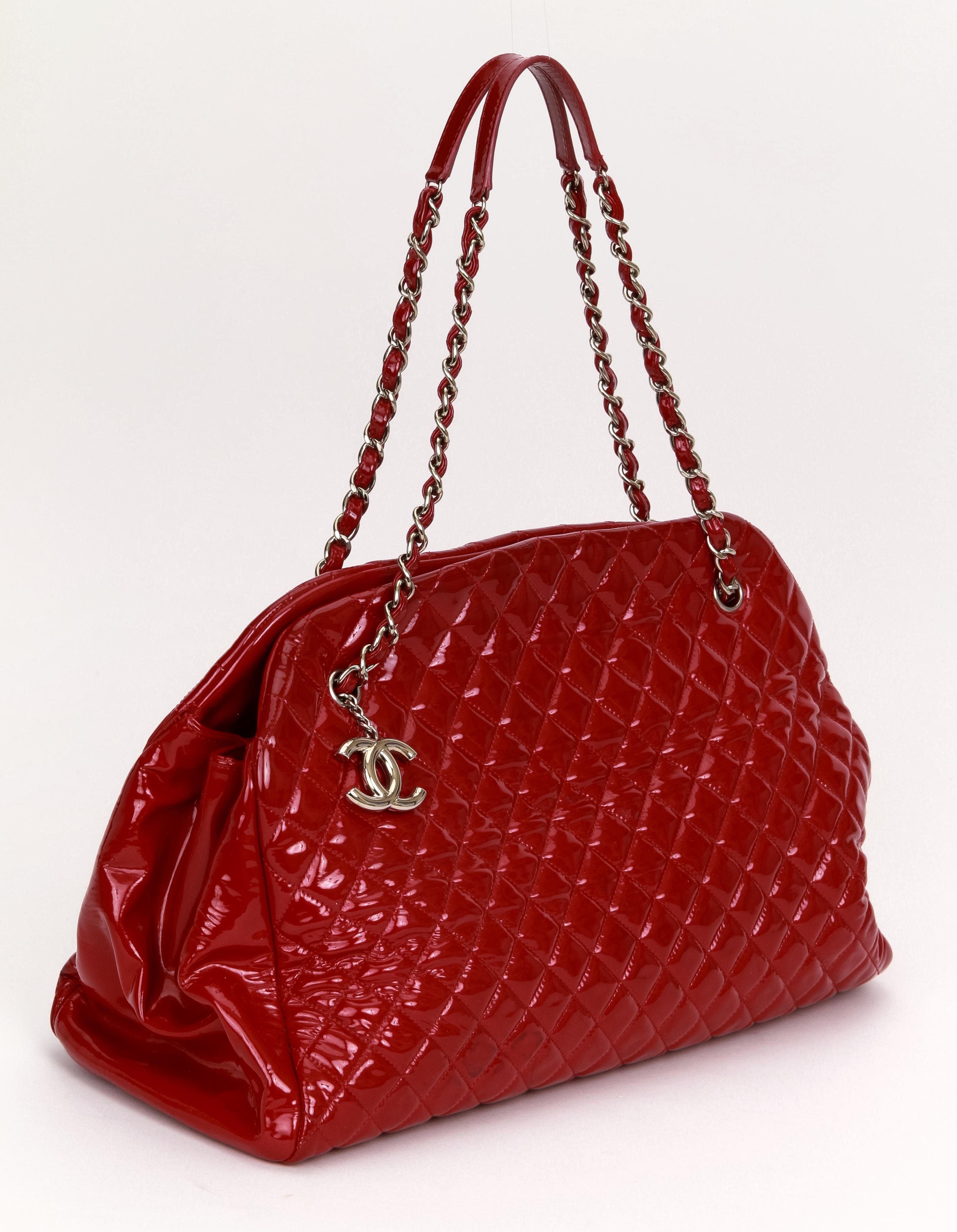 Chanel xxl red patent leather mademoiselle bag with silver tone hardware. Darkening is visible throughout the bag, please refer to photos. it looks like a degrade' design. Collection 2011. Shoulder drop 8