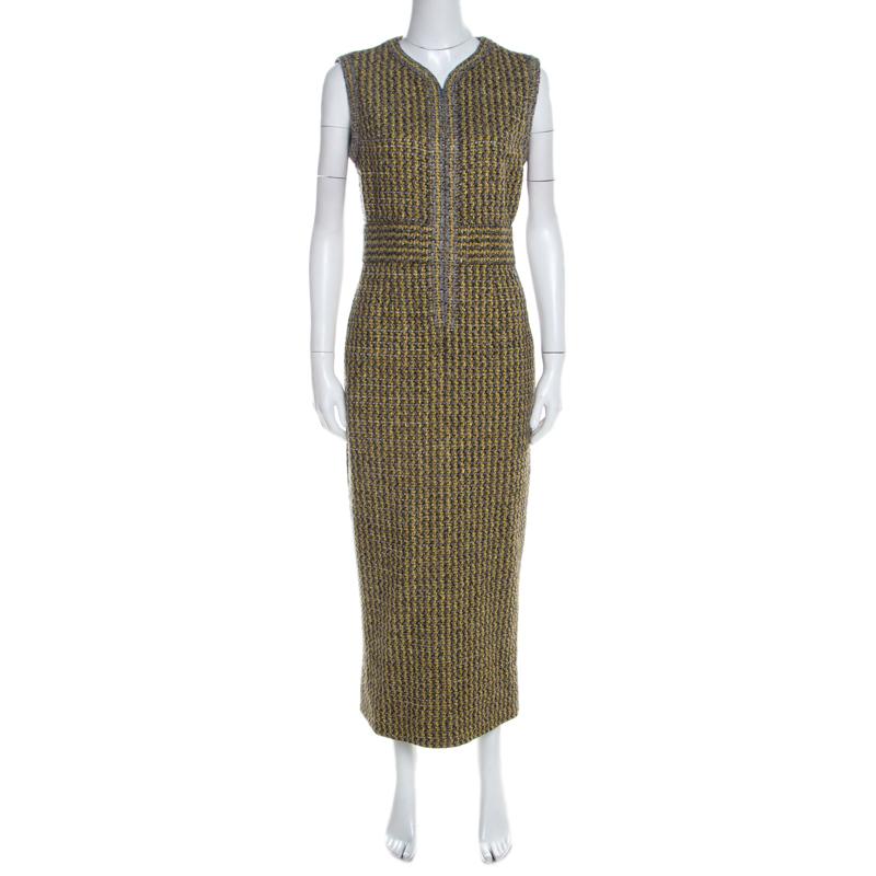 Chanel's tweed sets are a dream asset in the closet of any fashion-lover. Here's one just for you. This yellow and grey set comes made using the finest materials with stylish details. The sleeveless dress has a midi length and the blazer features a