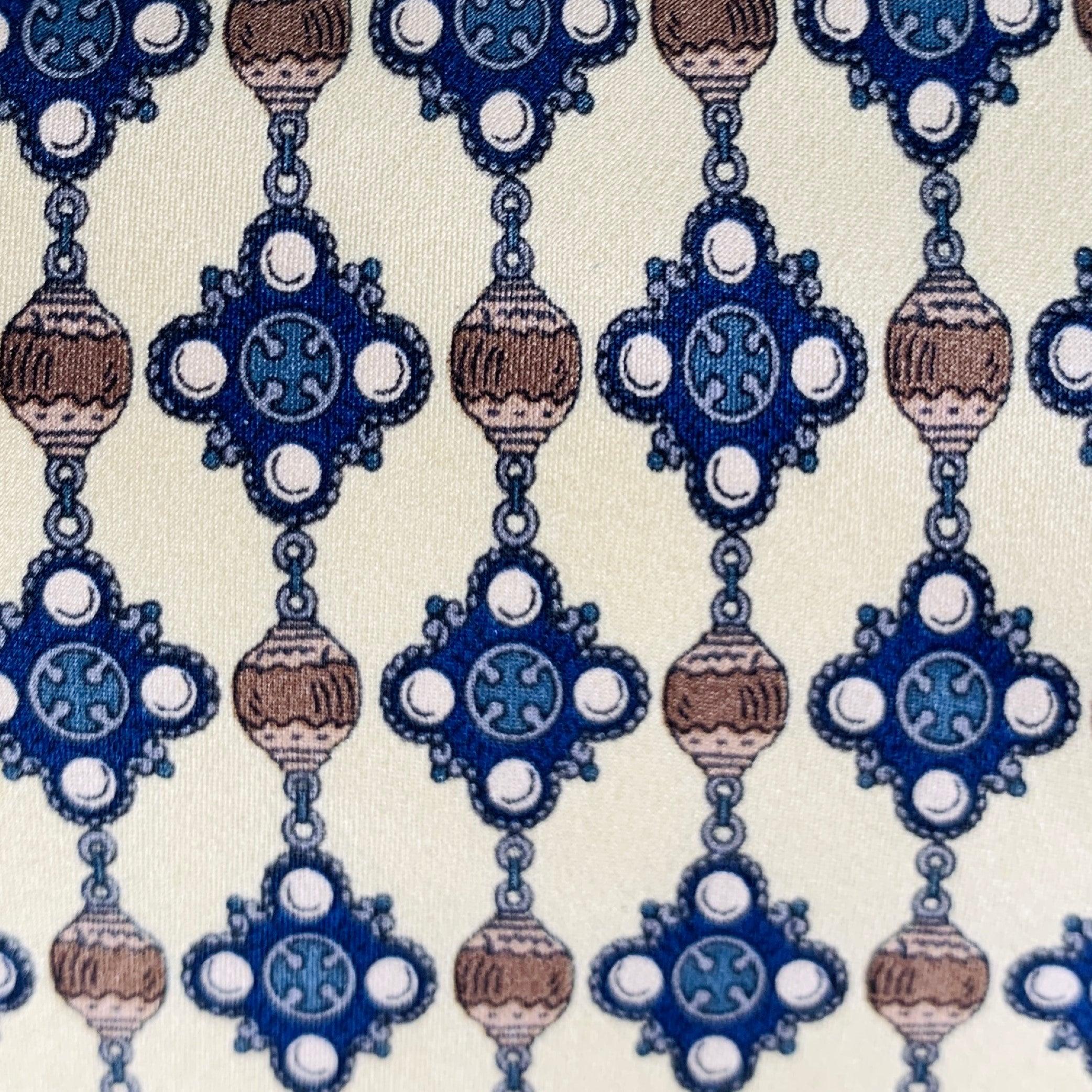 CHANEL necktie
in a yellow and blue silk featuring an abstract beaded print.Very Good Pre-Owned Condition. 

Measurements: 
  Width: 3.5 inches Length: 57.5 inches 
  
  
 
Sui Generis Reference: 132916
Category: Tie
More Details
    
Brand: 