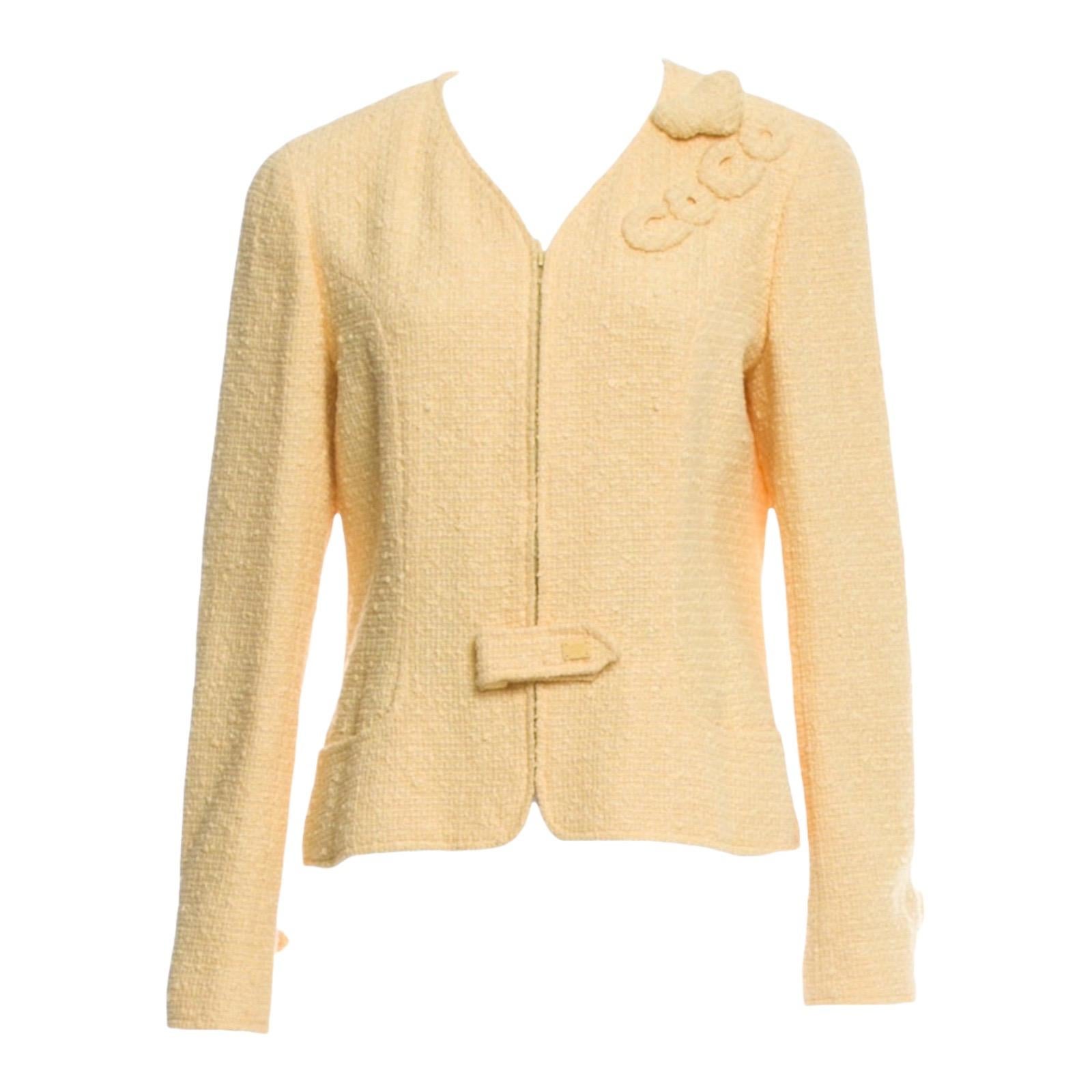 Beautiful CHANEL fantasy tweed jacket with heart and coco applications
A true CHANEL signature item that will last you for many years
Beautiful pale yellow tweed fabric
Jacket closes with zip and small latch with CC logo 
Completely lined with