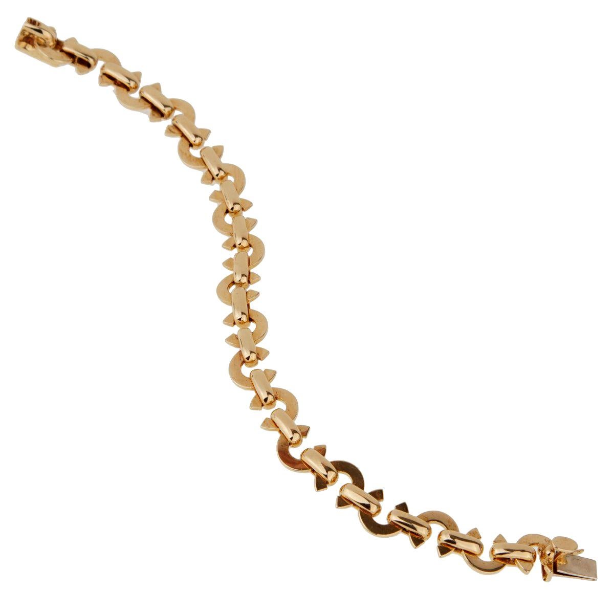 An iconic Chanel charm bracelet featuring alternating Chanel C motifs in 18k yellow gold. The bracelet measures 6 1/4