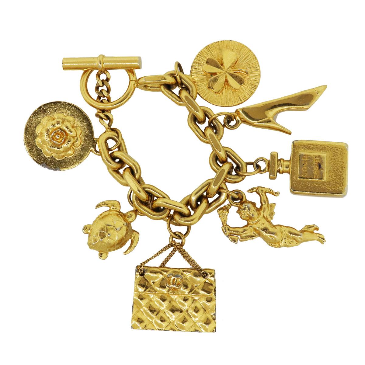 Chanel Yellow Gold Tone Multi Charm Bracelet In Good Condition In Boca Raton, FL