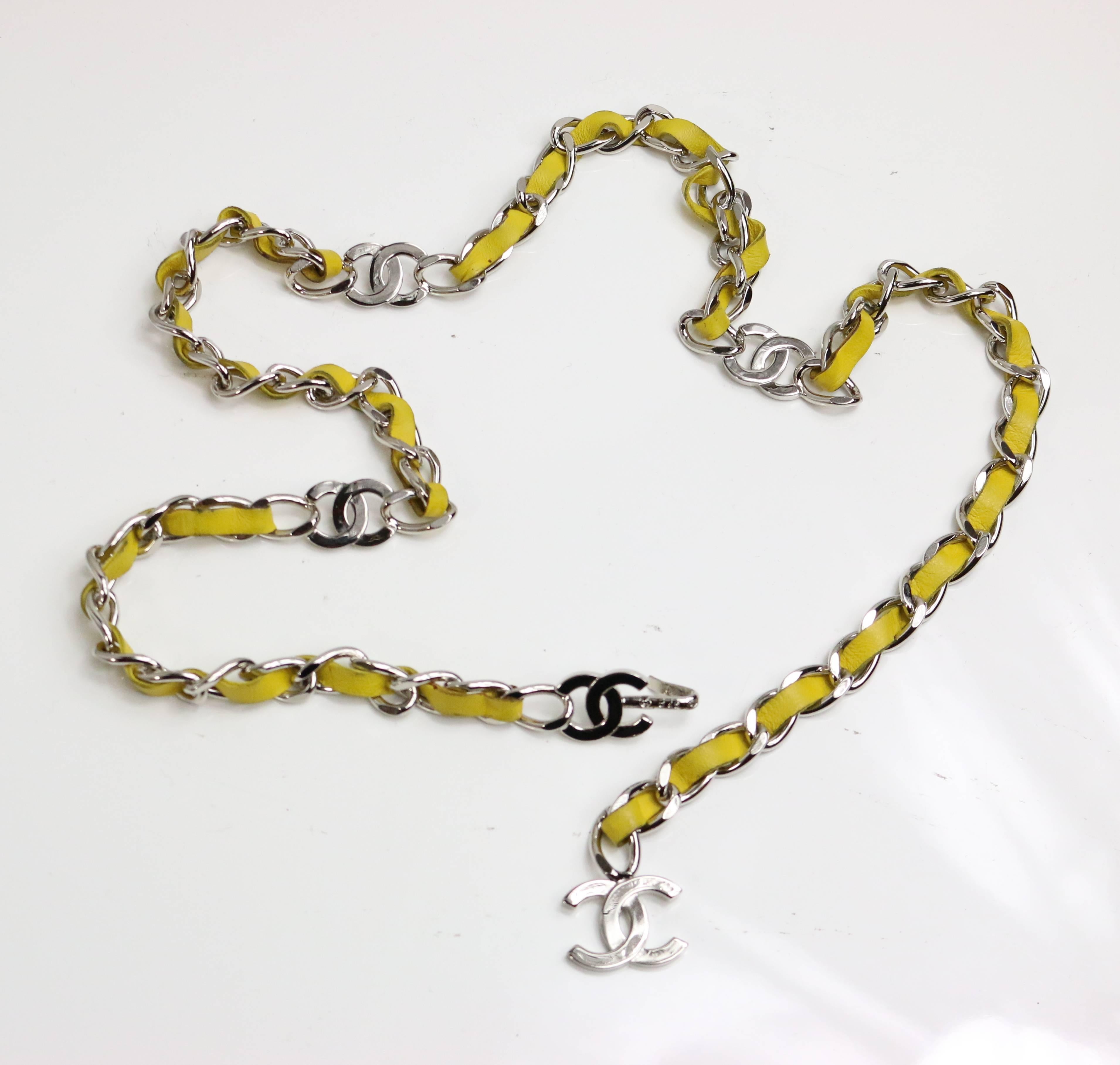 - Chanel yellow lambskin leather silver chain belt. 

- Featuring CC silver toned hardwares 

- Length: 35 inches (89cm approximately).  Width: 0.25 inches. (1cm approximately). 

- Made in France. 

