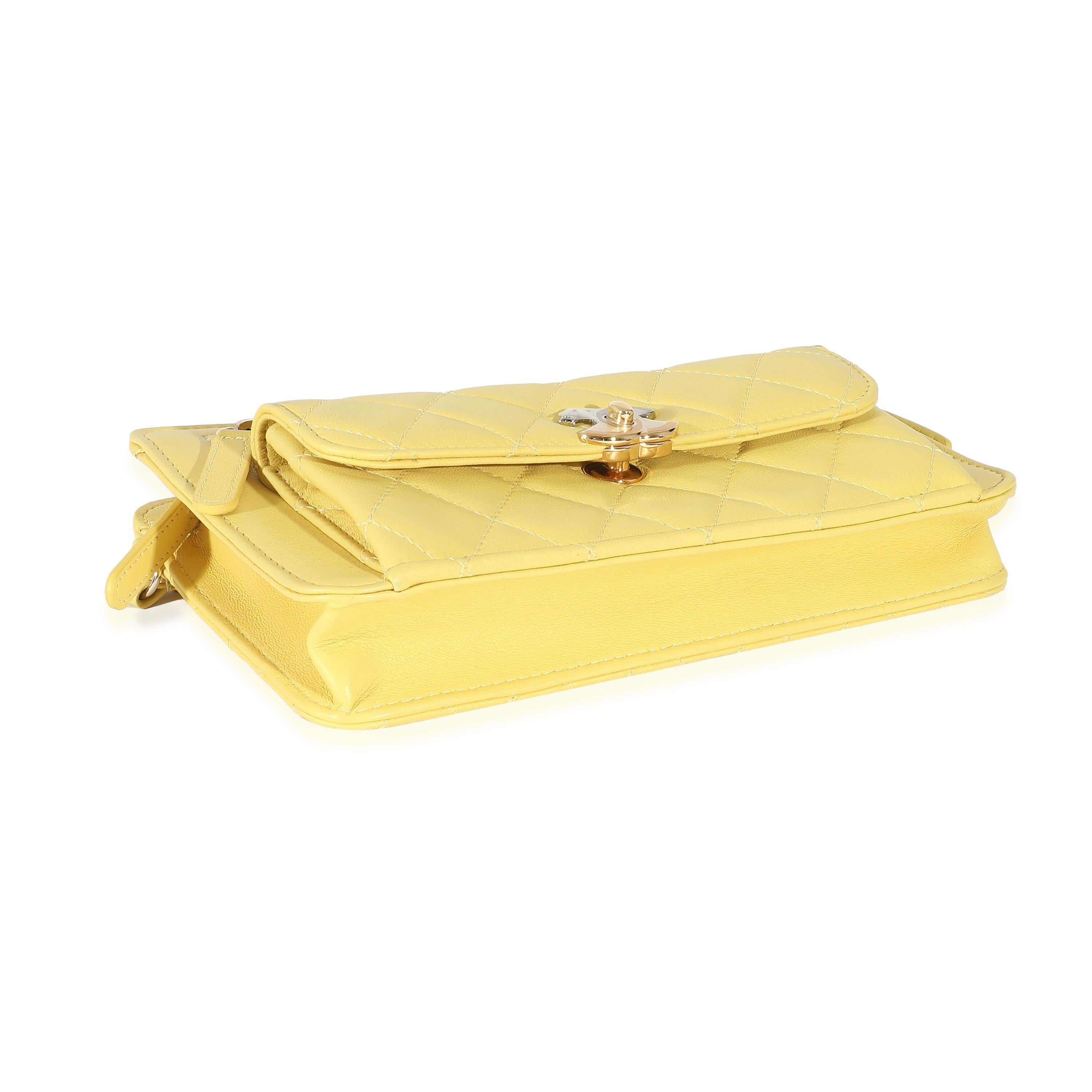 Listing Title: Chanel Yellow Lambskin Quilted Front Pocket Wristlet
SKU: 132481
Condition: Pre-owned 
Handbag Condition: Excellent
Brand: Chanel
Model: Front Pocket Wristlet
Origin Country: Italy
Handbag Silhouette: Top Handle
Occasions: