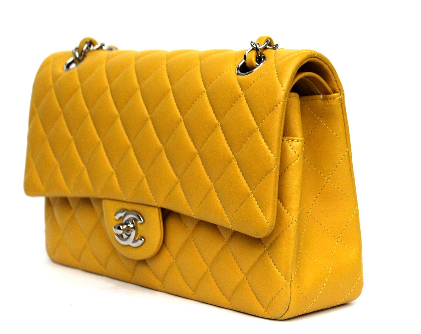 Chanel 2.55 double flap in medium size mustard color and silver hardware.