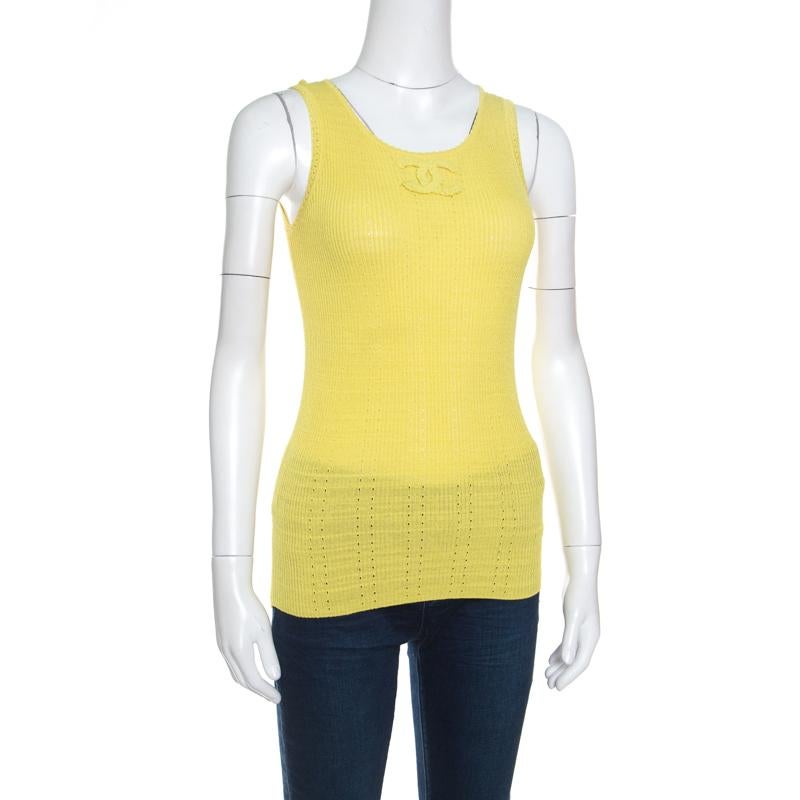 It's impressive how such a simple style looks so exquisite; this Chanel top has been beautifully crafted in a blend of cotton and nylon with perforated patterns. The yellow top is accentuated with ribbed knitting and features the signature CC