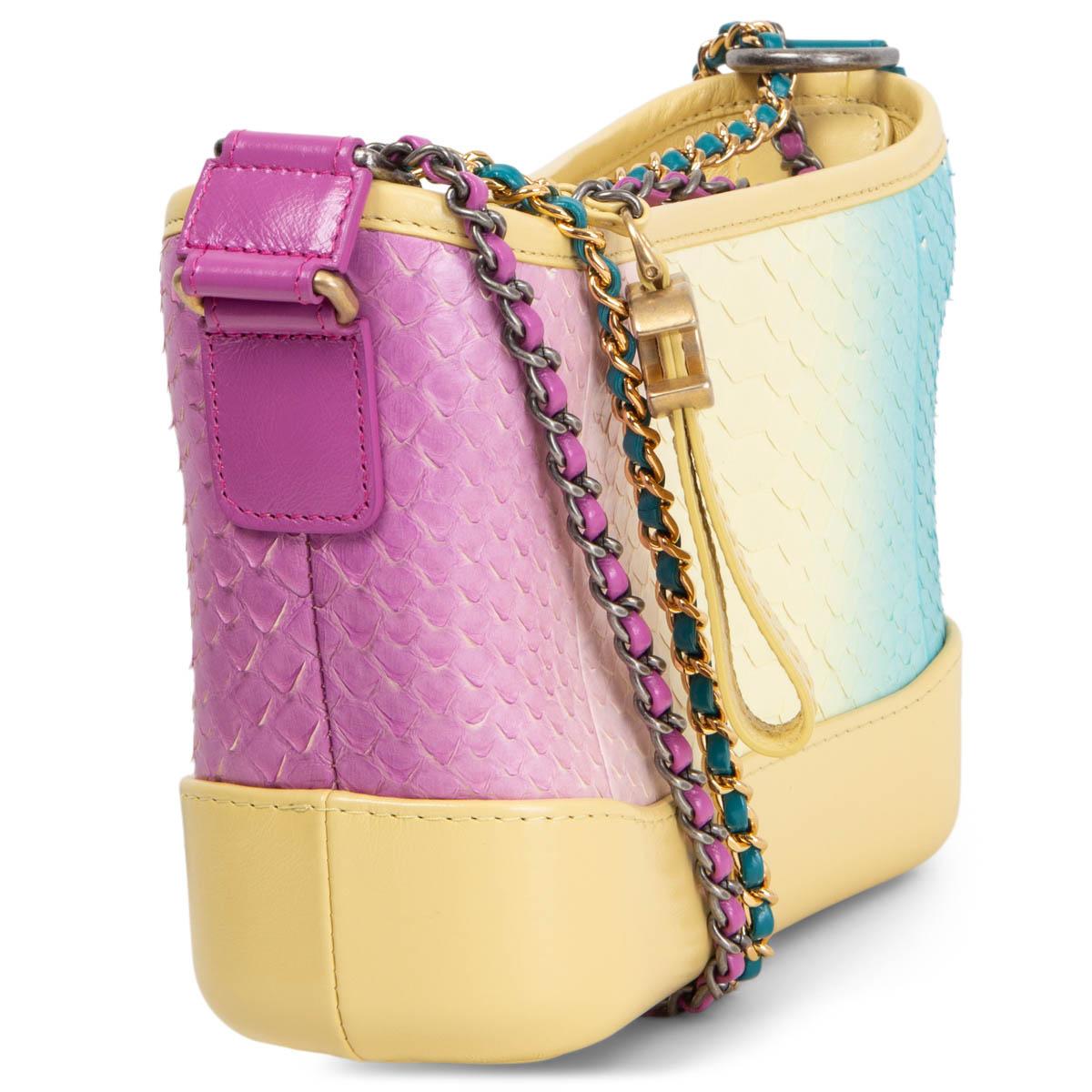 100% authentic Chanel 2019 Cruise Python Small Gabrielle hobo bag in gradient vanilla, petrol, turquoise, pink and rose pink python. Opens with a zipper on top and is lined in vanilla lambskin with one zipper pocket against the back and an open
