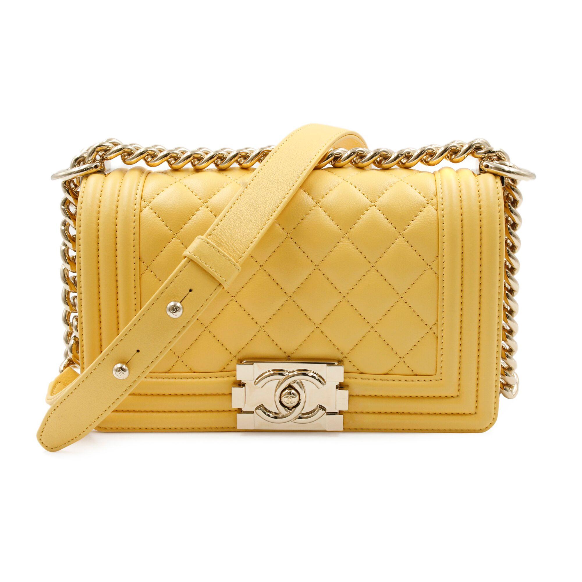 Chanel Boy Flap Bag Quilted Lambskin Small is every woman's dream. Crafted from yellow quilted lambskin leather. This Boy flap bag features a chunky chain link strap with shoulder pad, CC Boy logo push-lock closure, and gold-tone hardware accents.