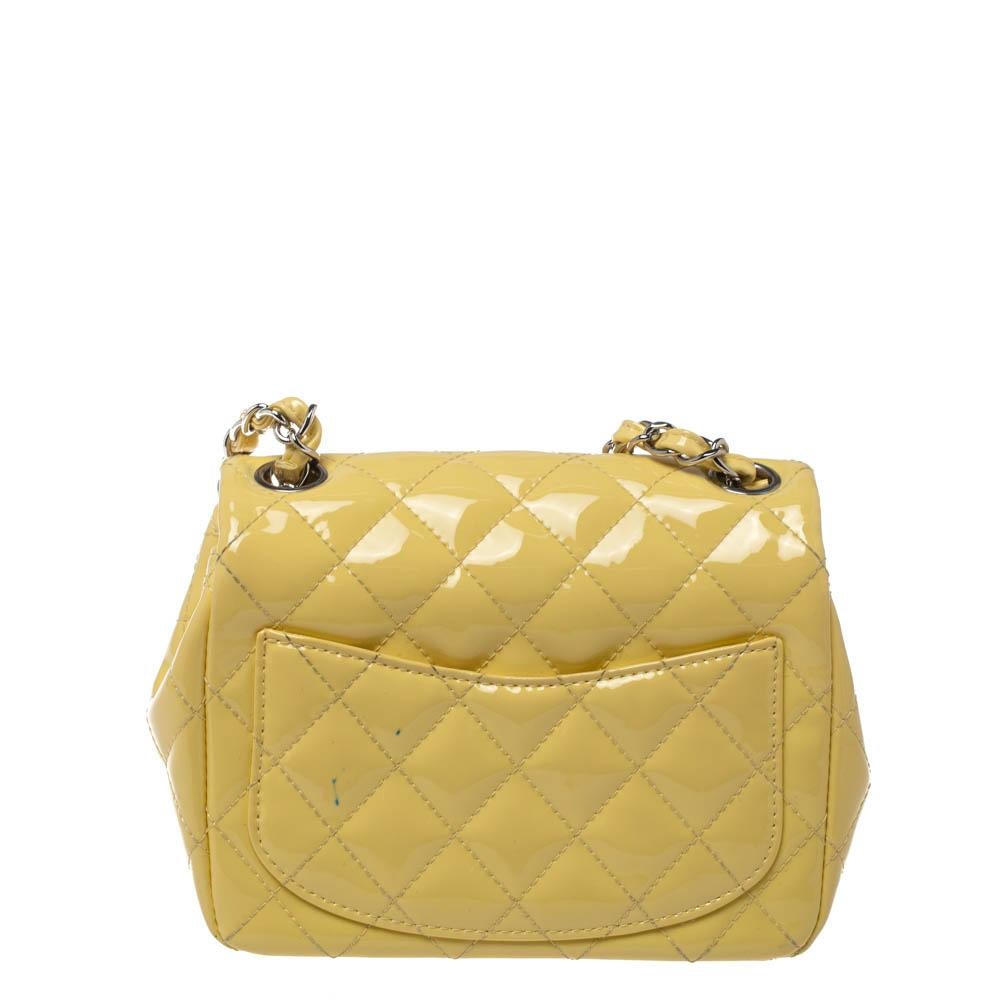 We are in utter awe of this flap bag from Chanel as it is appealing in a surreal way. Exquisitely crafted from yellow patent leather in a quilted pattern, it bears the signature label on the leather interior and the iconic CC turn-lock on the flap.