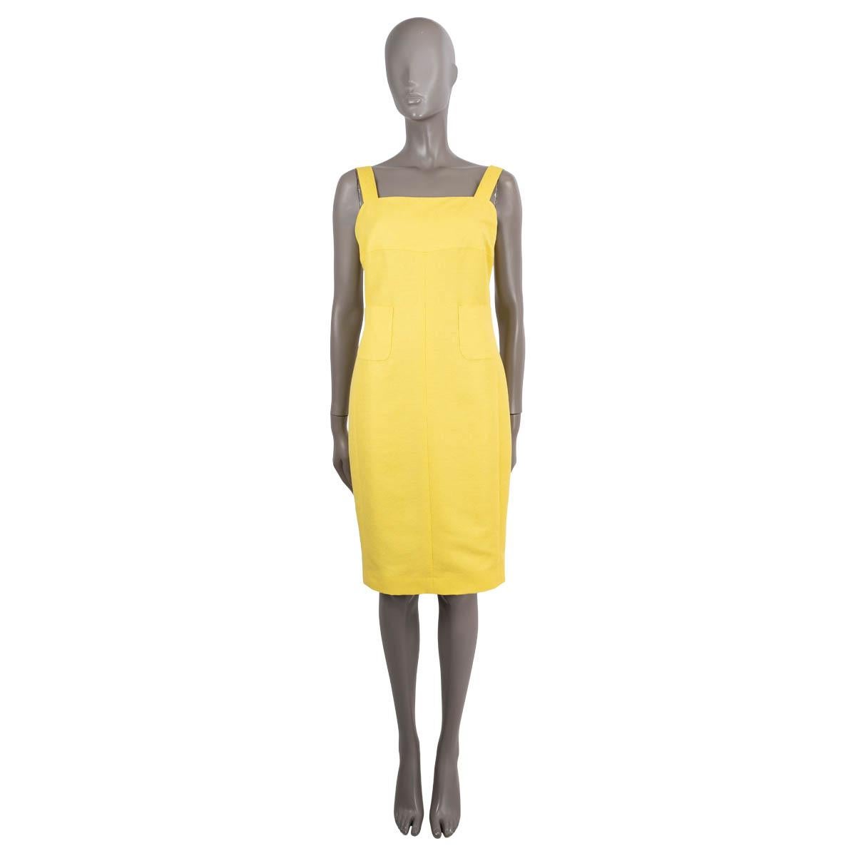 100% authentic Chanel sleeveless sheath dress in yellow lurex crepe silk (with 12% nylon). Features a fitted silhouette with two patch pockets on the front. Opens with a concealed zipper in the back. Lined in cotton (55%) and silk (45%). Has been