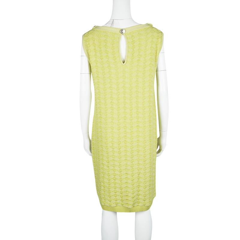 Minimally divine in a bright yellow lurex knit, this sweater is a luxurious but practical investment that you can wear season after season. Cut in a relaxed, knee-length fit, it is fashioned with oversized ribbed patch pockets and shoulders that add