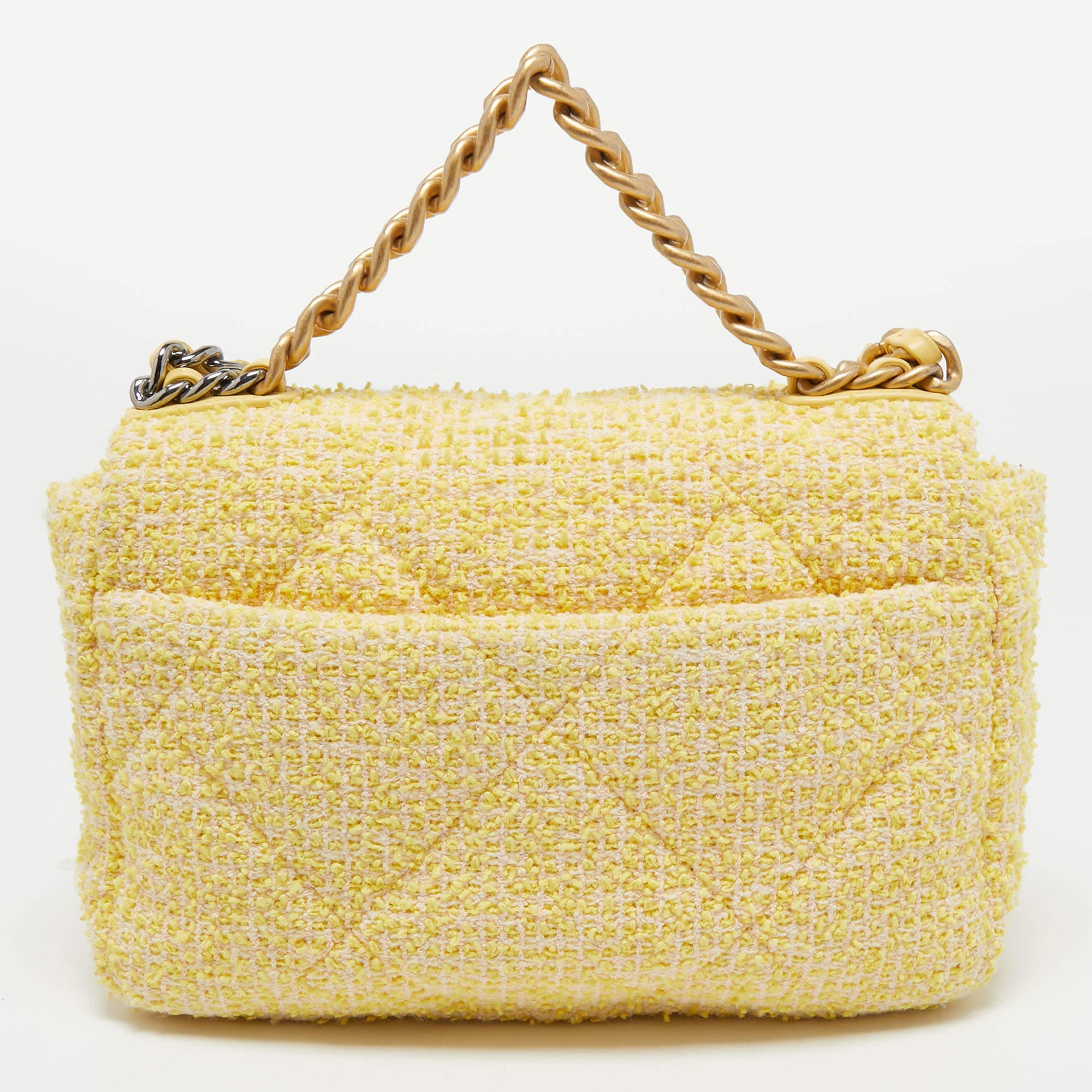 First unveiled in the Chanel Fall 2019 collection, the Chanel 19 bag is named after the year of its release, just like the Chanel 2.55. In design, the bag has exaggerated quilting and hardware in two tones. This version in yellow is made from tweed