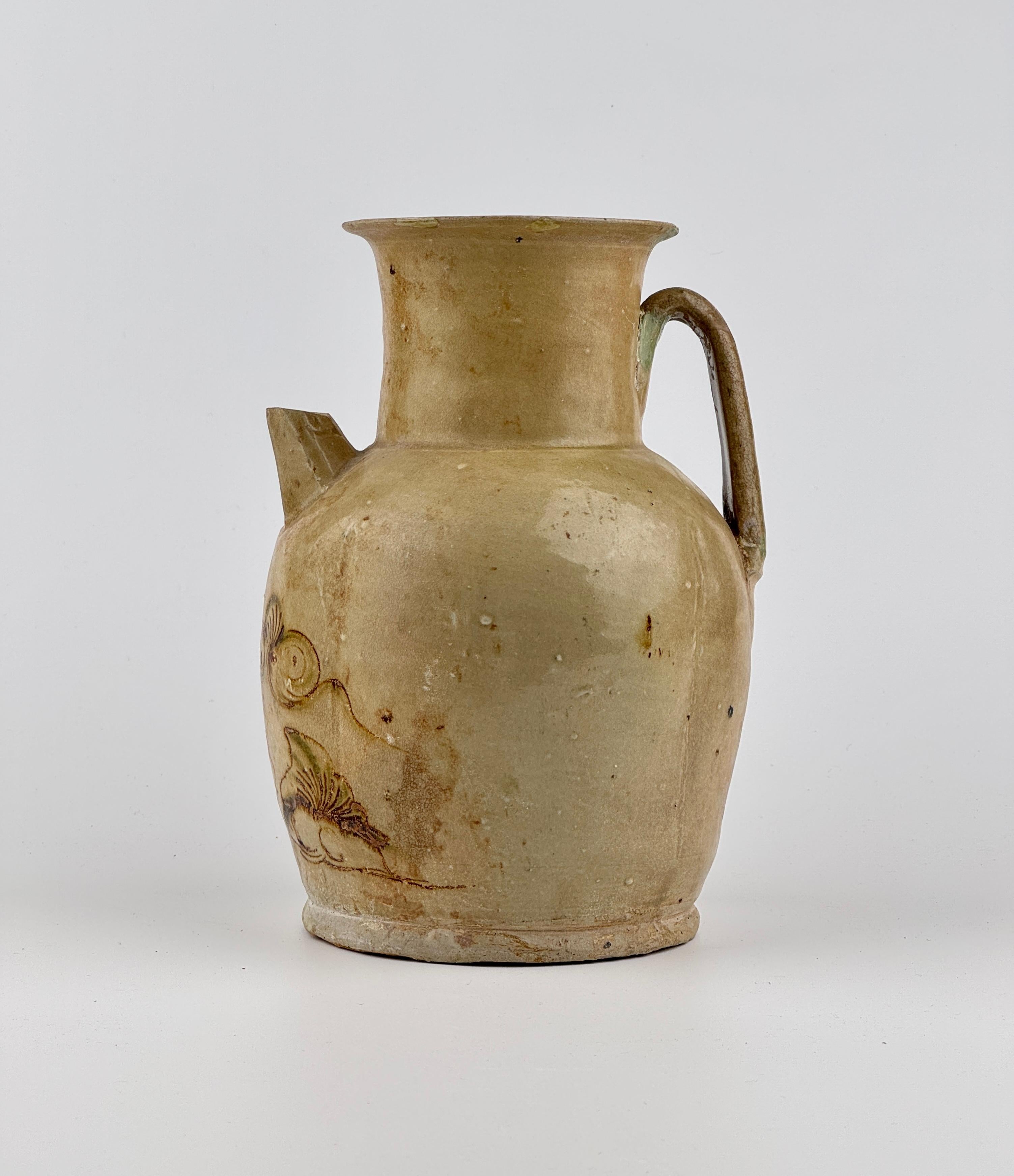 Changsha Ware has distinct and recognizable designs and motifs. Painted designs often depict flowers, vines, clouds and mountain landscapes. Some painting is simply splotches of color that accentuate stamped and molded clay ornaments. You can see